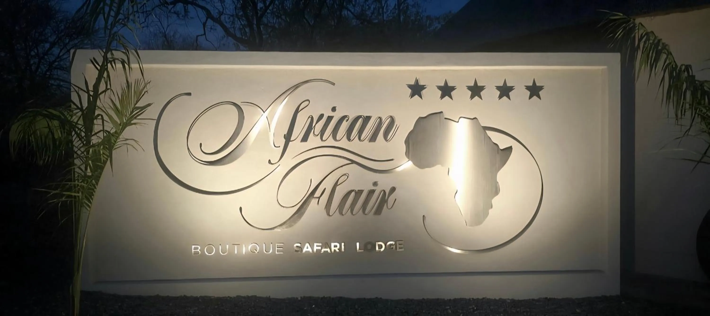 Property logo or sign in African Flair Boutique Safari Lodge