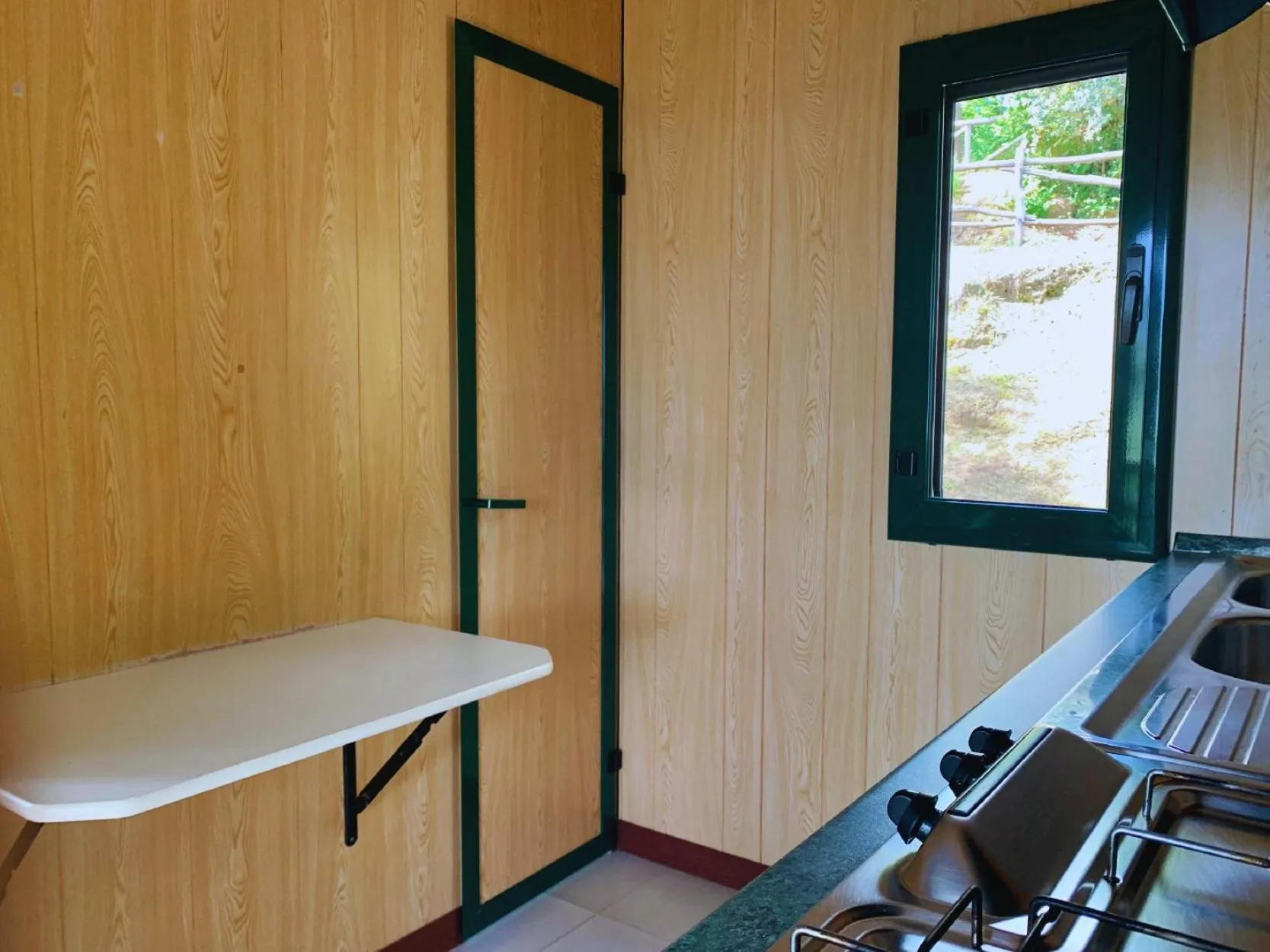 Kitchen or kitchenette in Village Camping Santa Fortunata - Campogaio