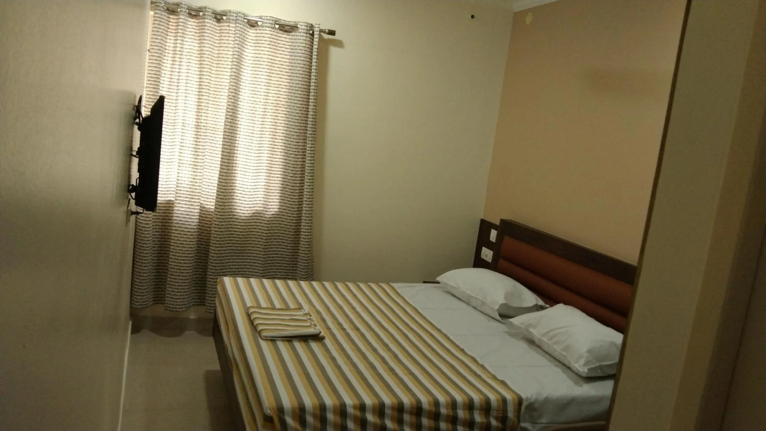 Bed in Hotel Grand Stay