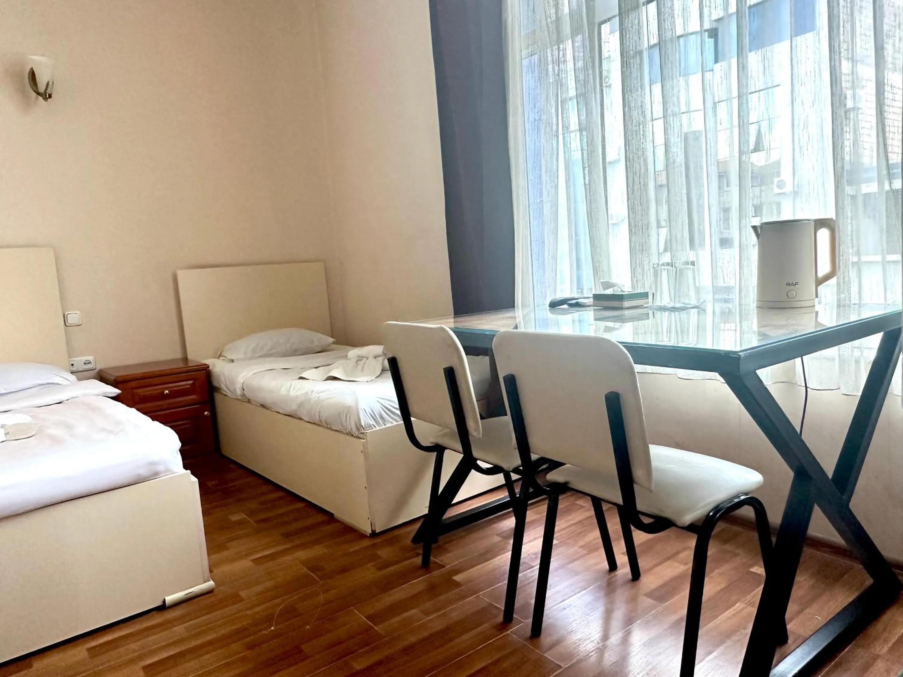 Bed in NEW BELLA HOTEL