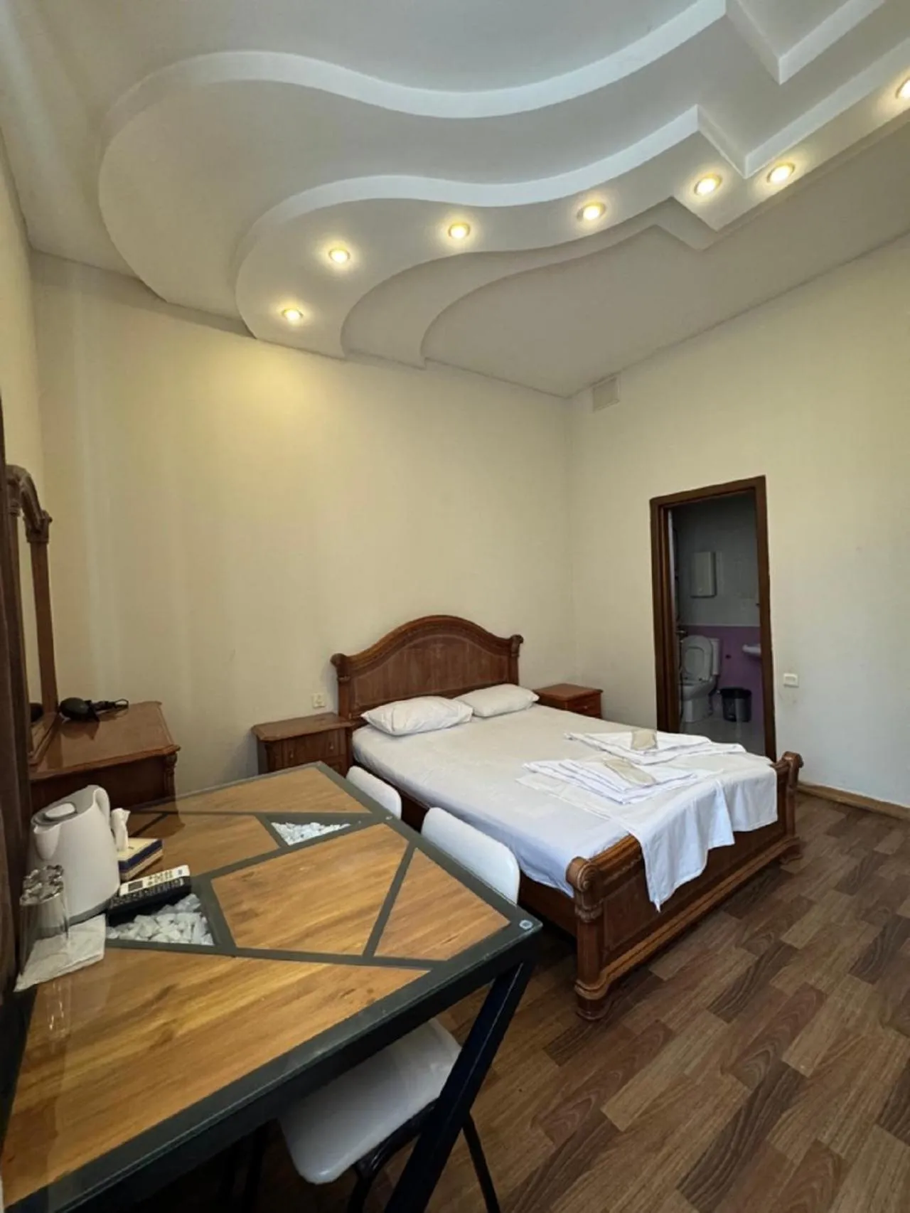 Bed in NEW BELLA HOTEL