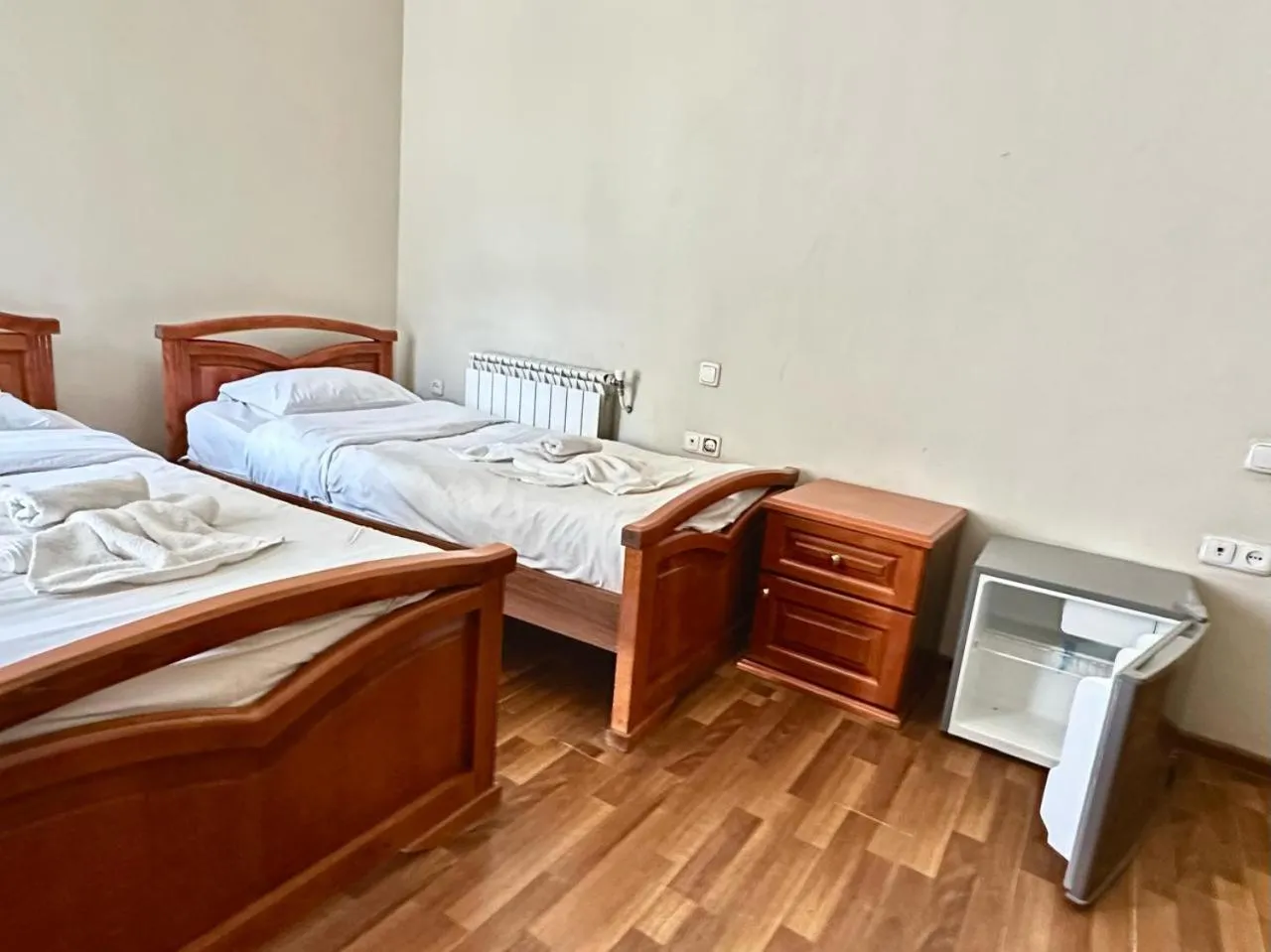 Bed in NEW BELLA HOTEL