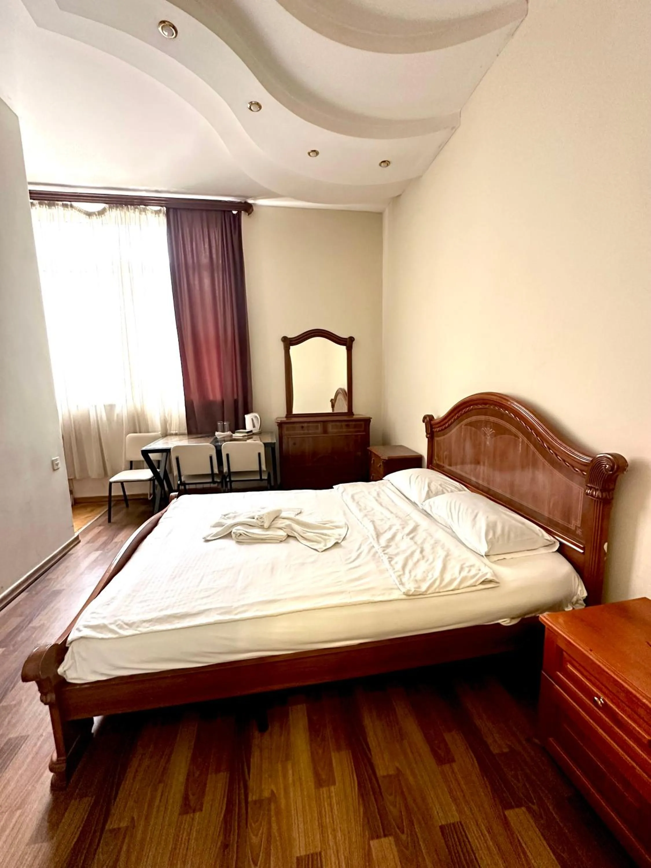 Bed in NEW BELLA HOTEL