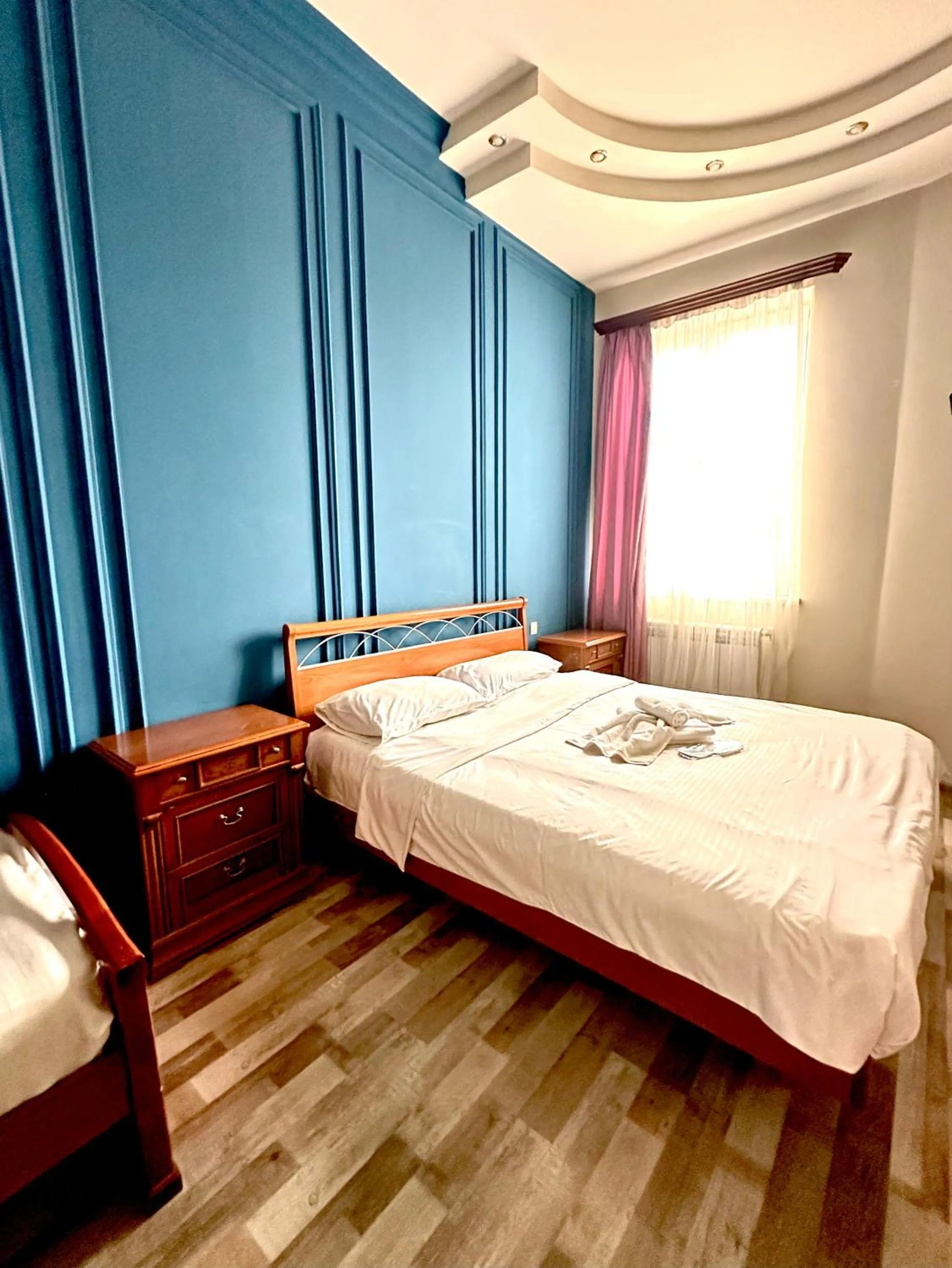 Bed in NEW BELLA HOTEL