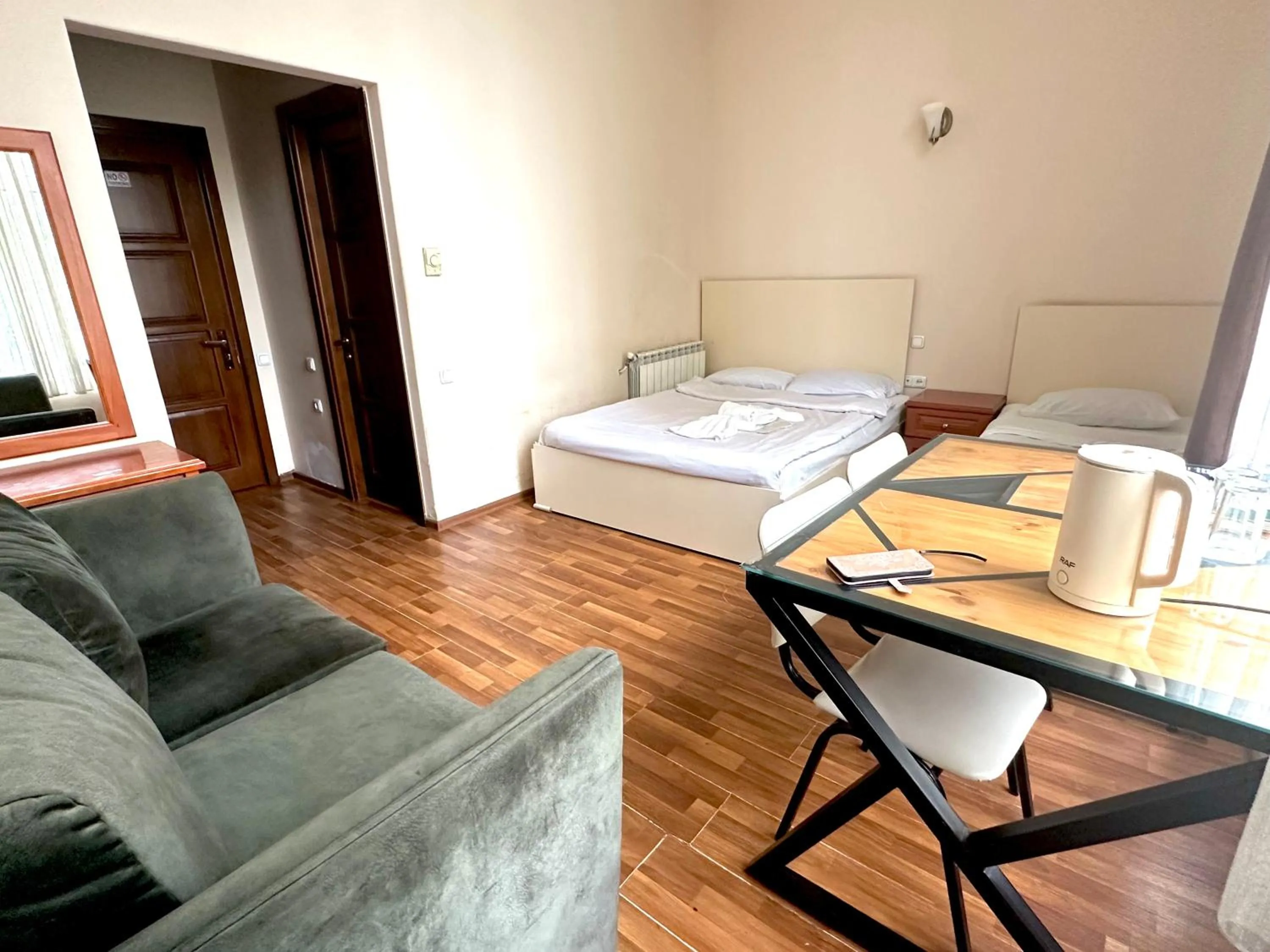 Bed in NEW BELLA HOTEL