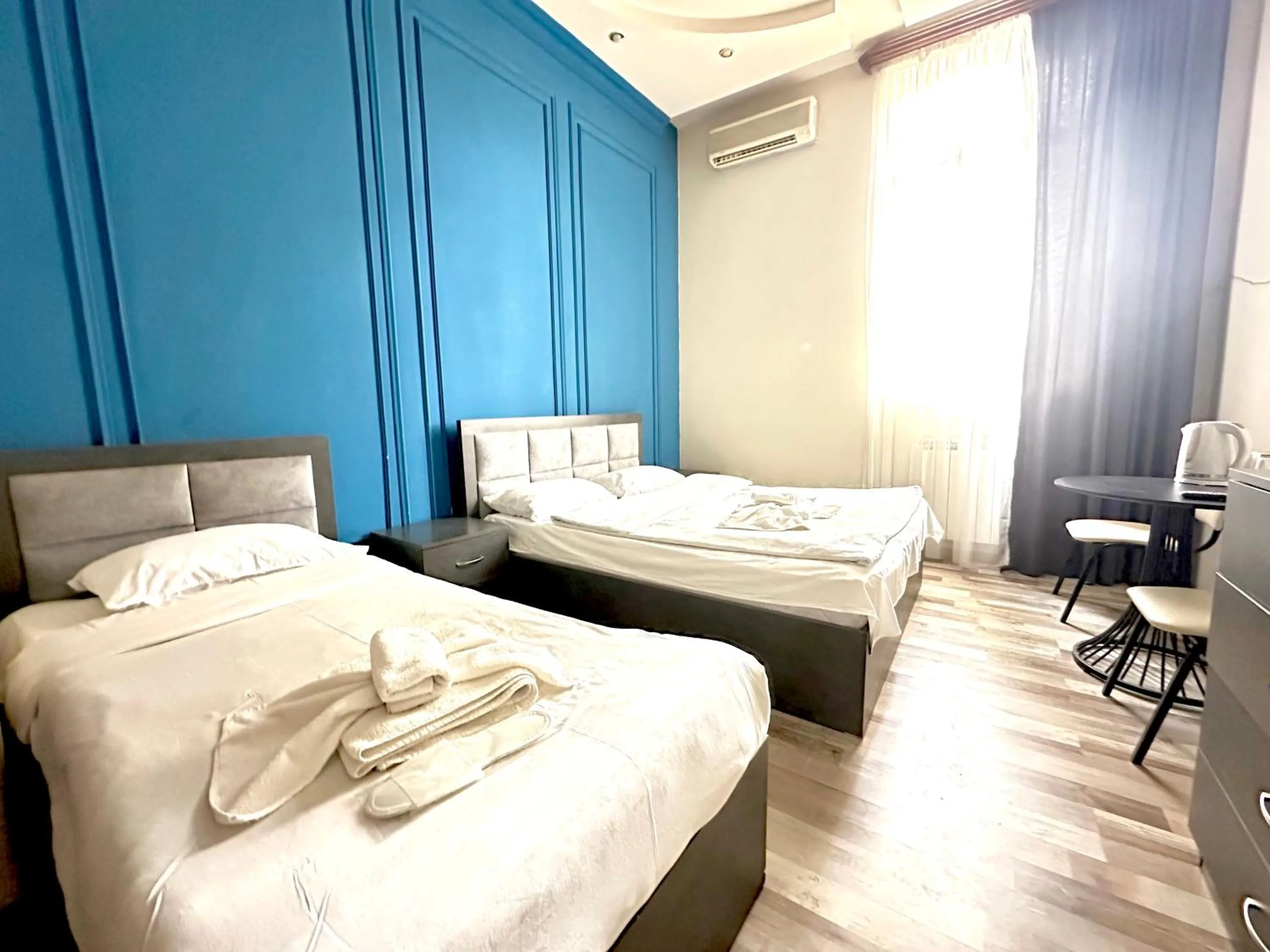 Bed in NEW BELLA HOTEL