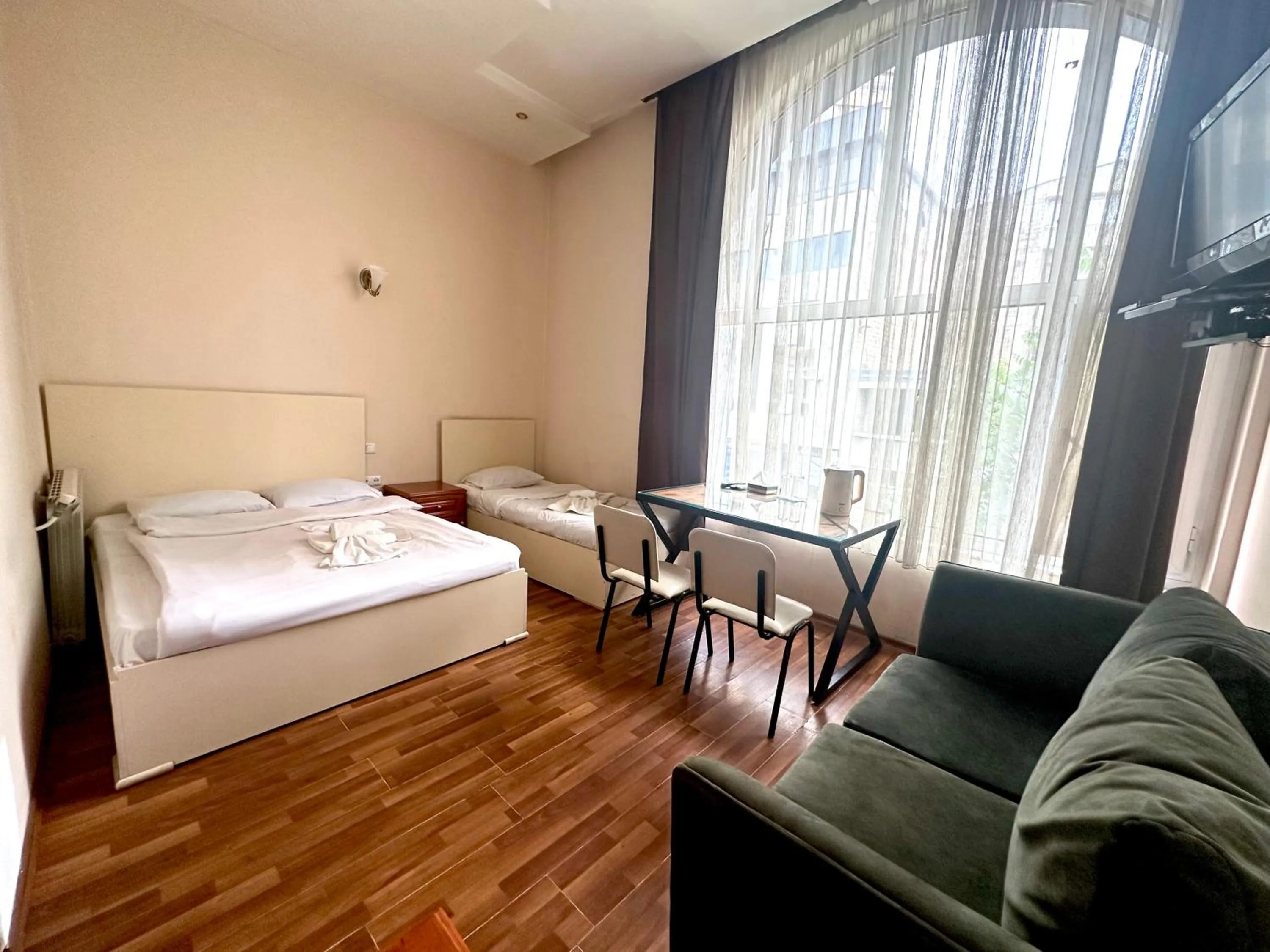 Bed in NEW BELLA HOTEL