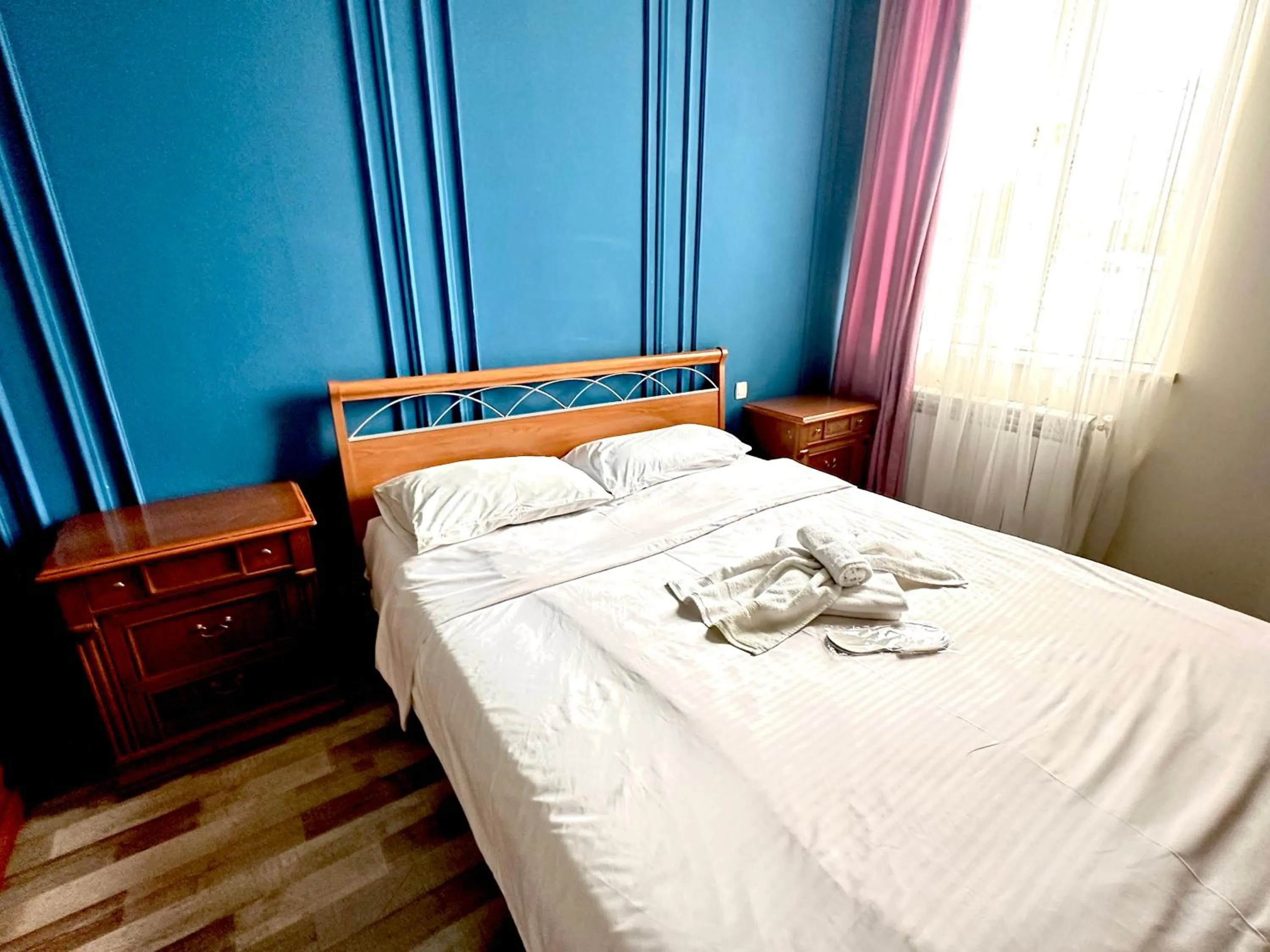 Bed in NEW BELLA HOTEL