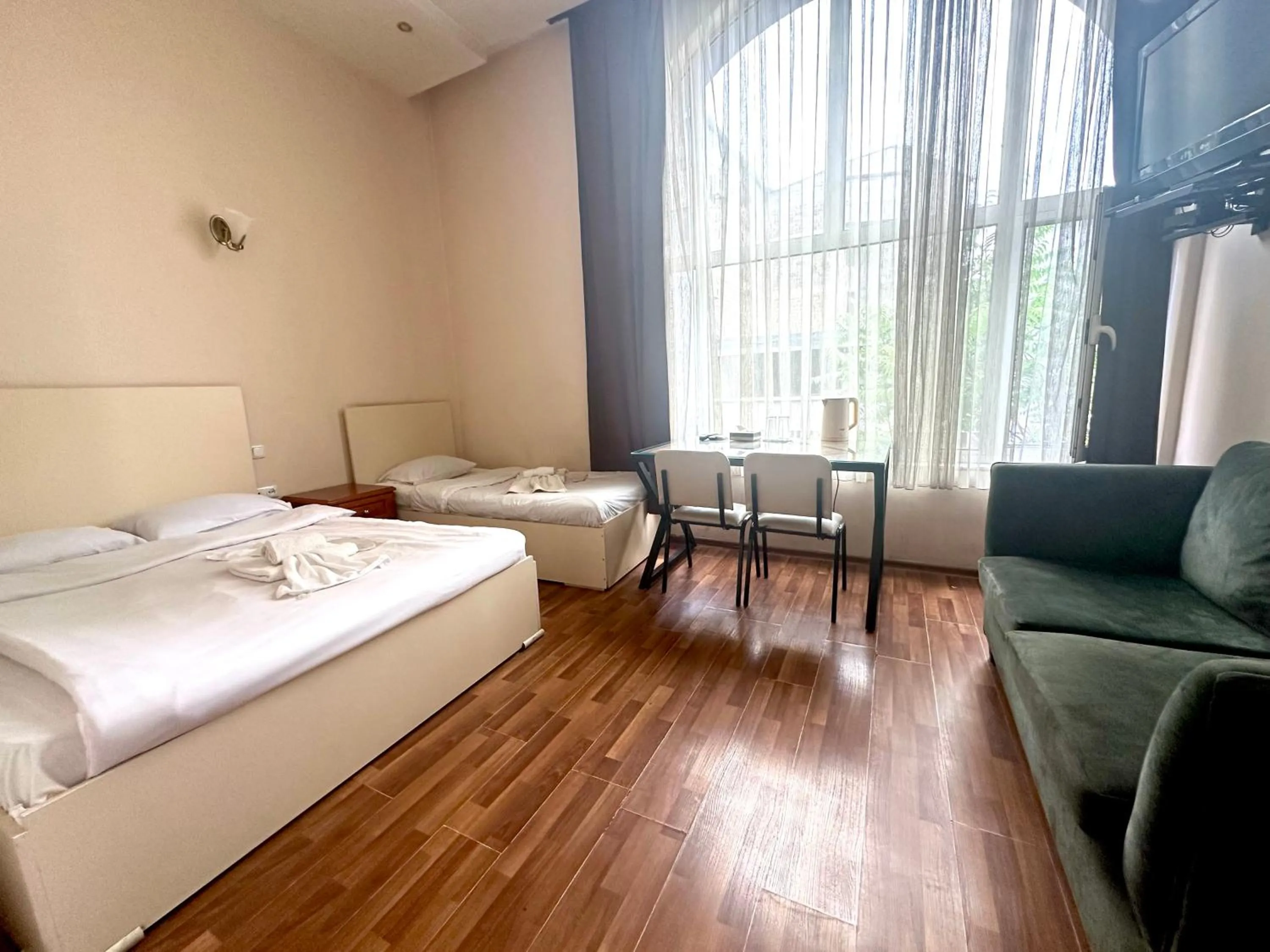 Bed in NEW BELLA HOTEL