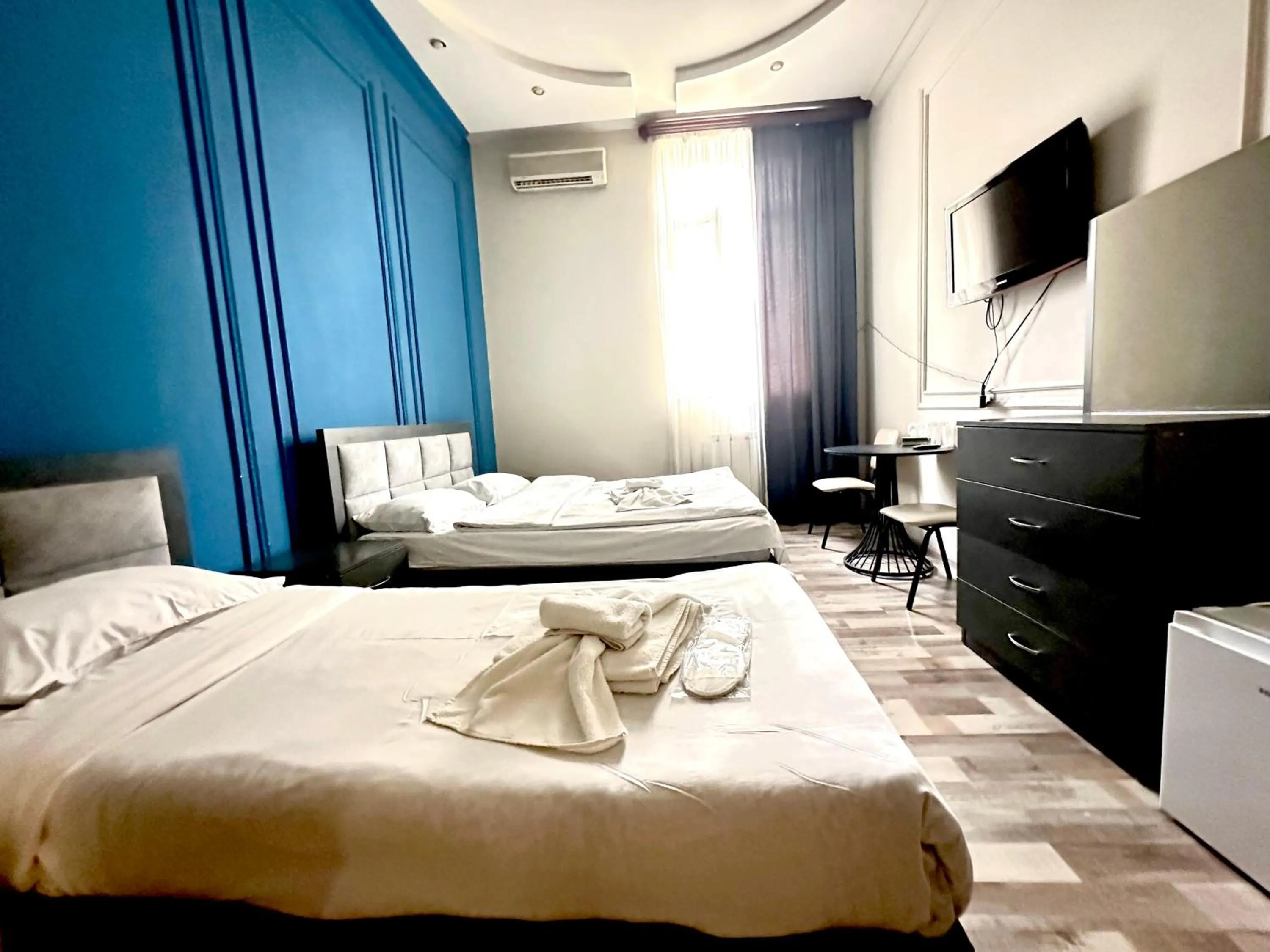 Bed in NEW BELLA HOTEL