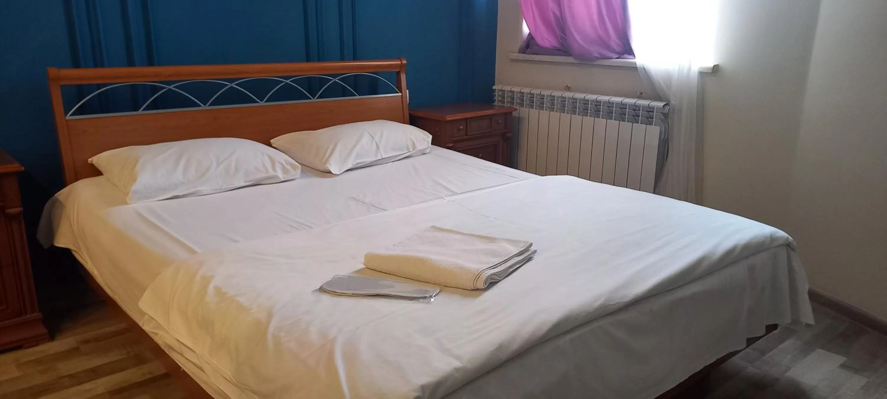 Bed in NEW BELLA HOTEL