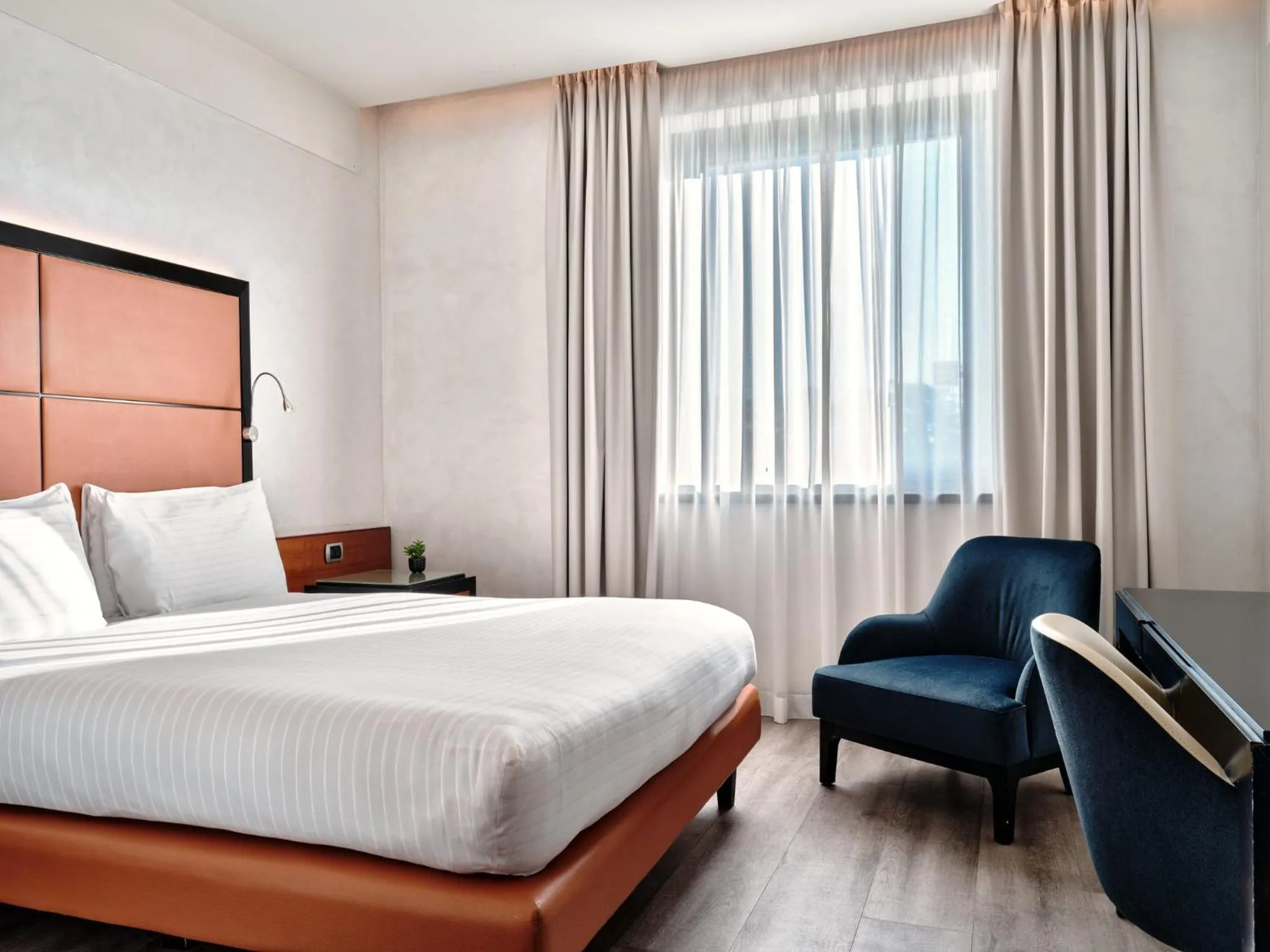 Photo of the whole room, Bed in Crowne Plaza Milan - Malpensa Airport by IHG