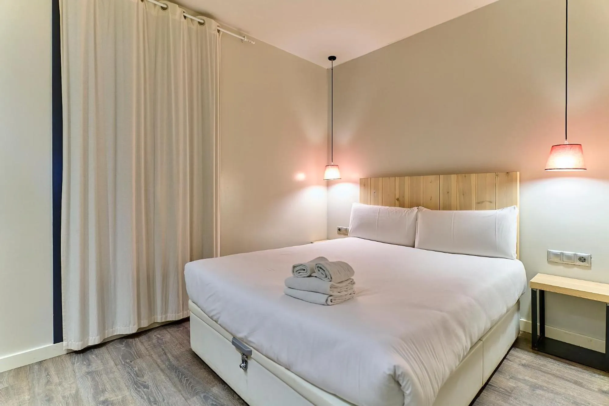 Bed in Montserrat Apartments by gaiarooms