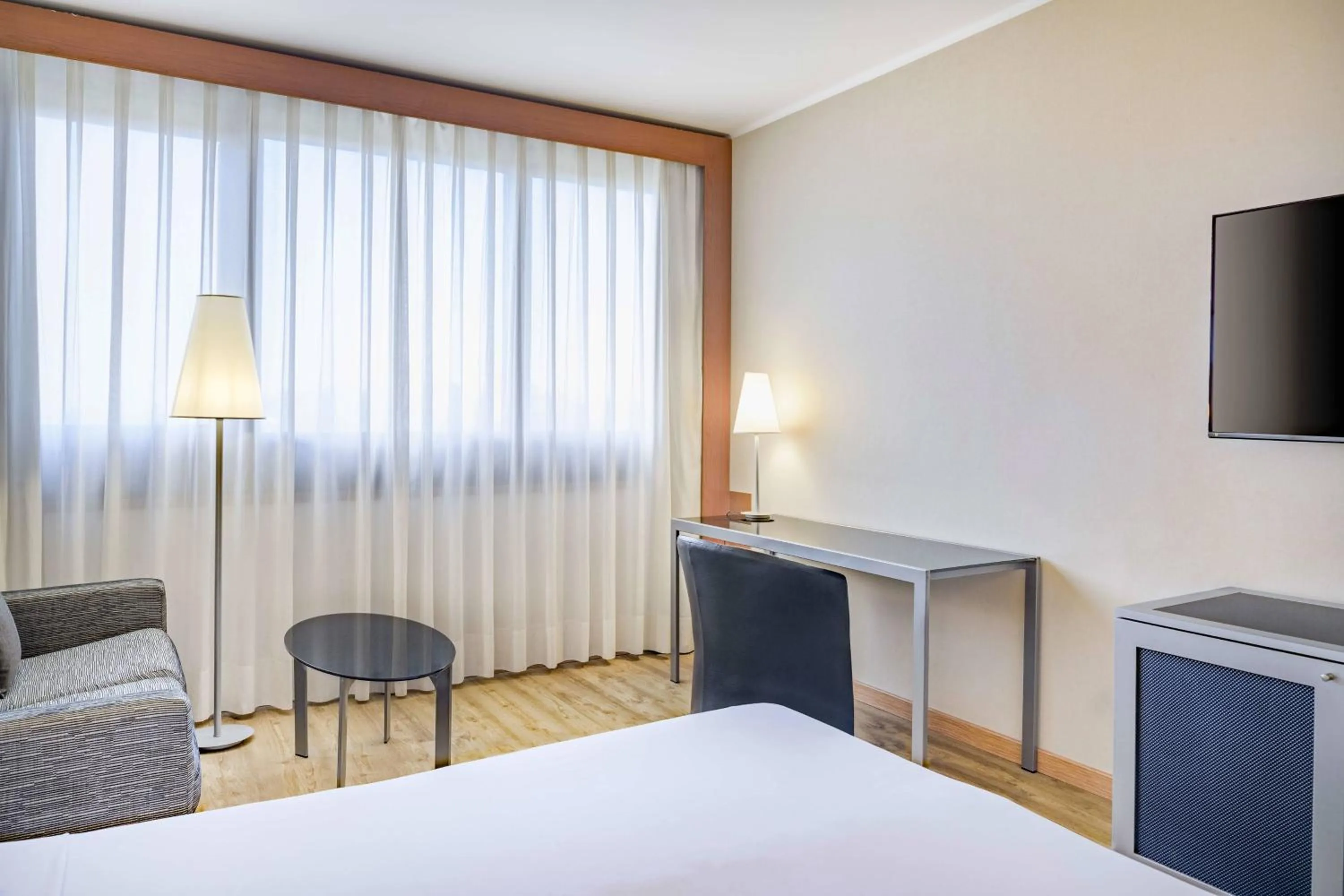 Photo of the whole room, Bed in AC Hotel Genova by Marriott