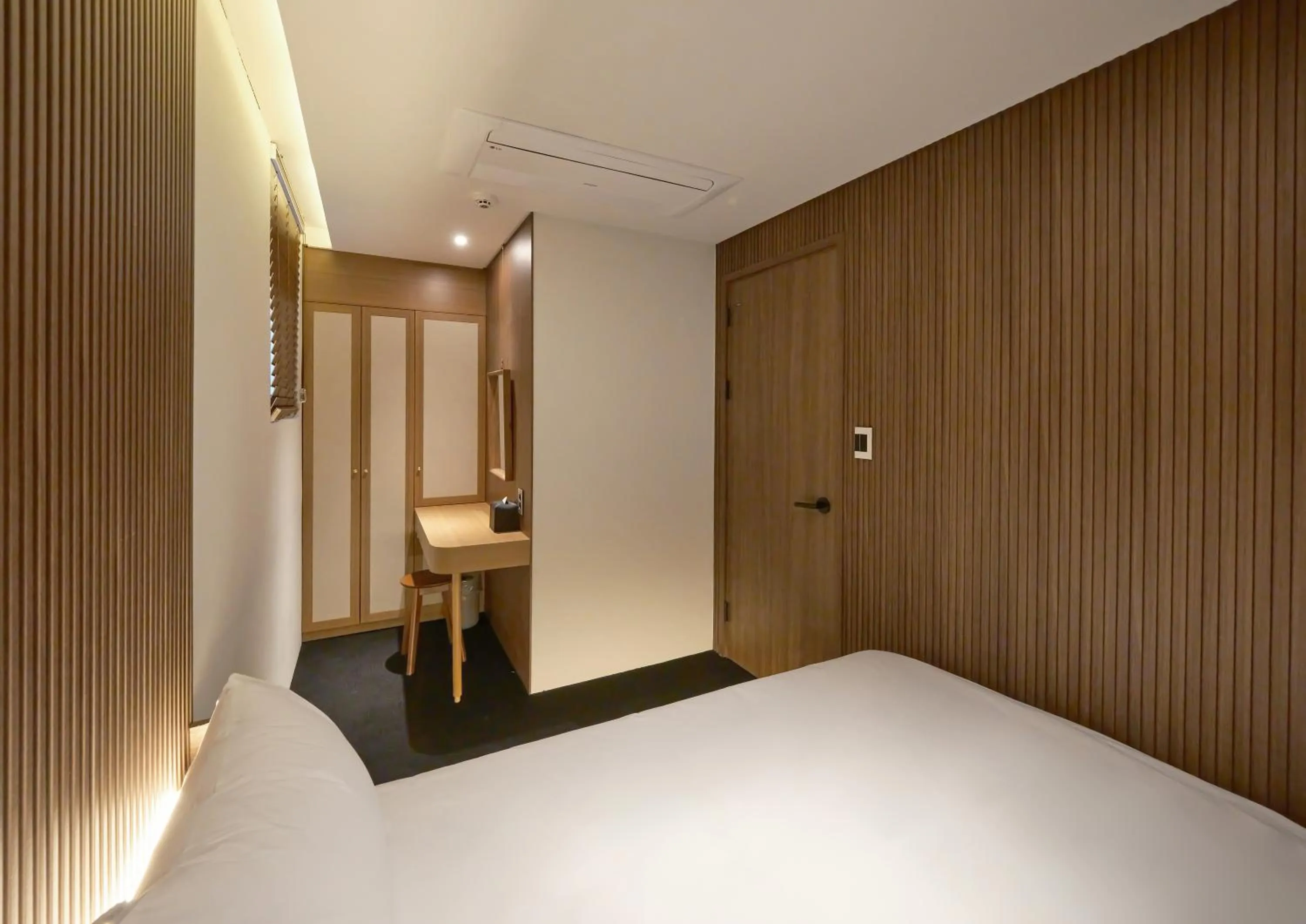 Bedroom, TV/Entertainment Center in UH Suite The Myeongdong