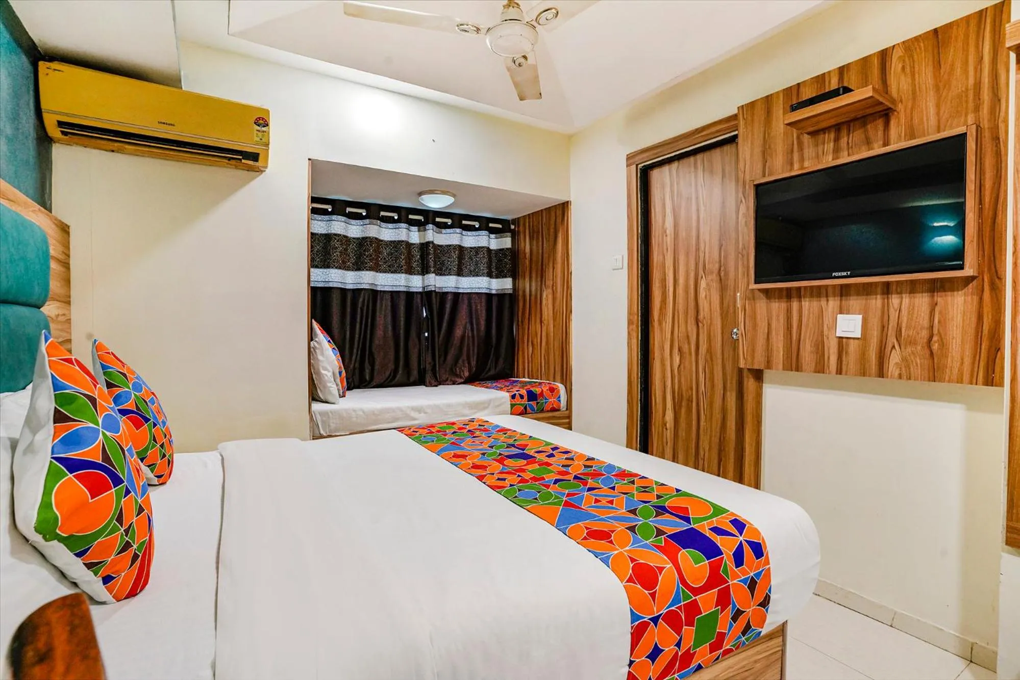 Bed in FabHotel Amber Corp Inn