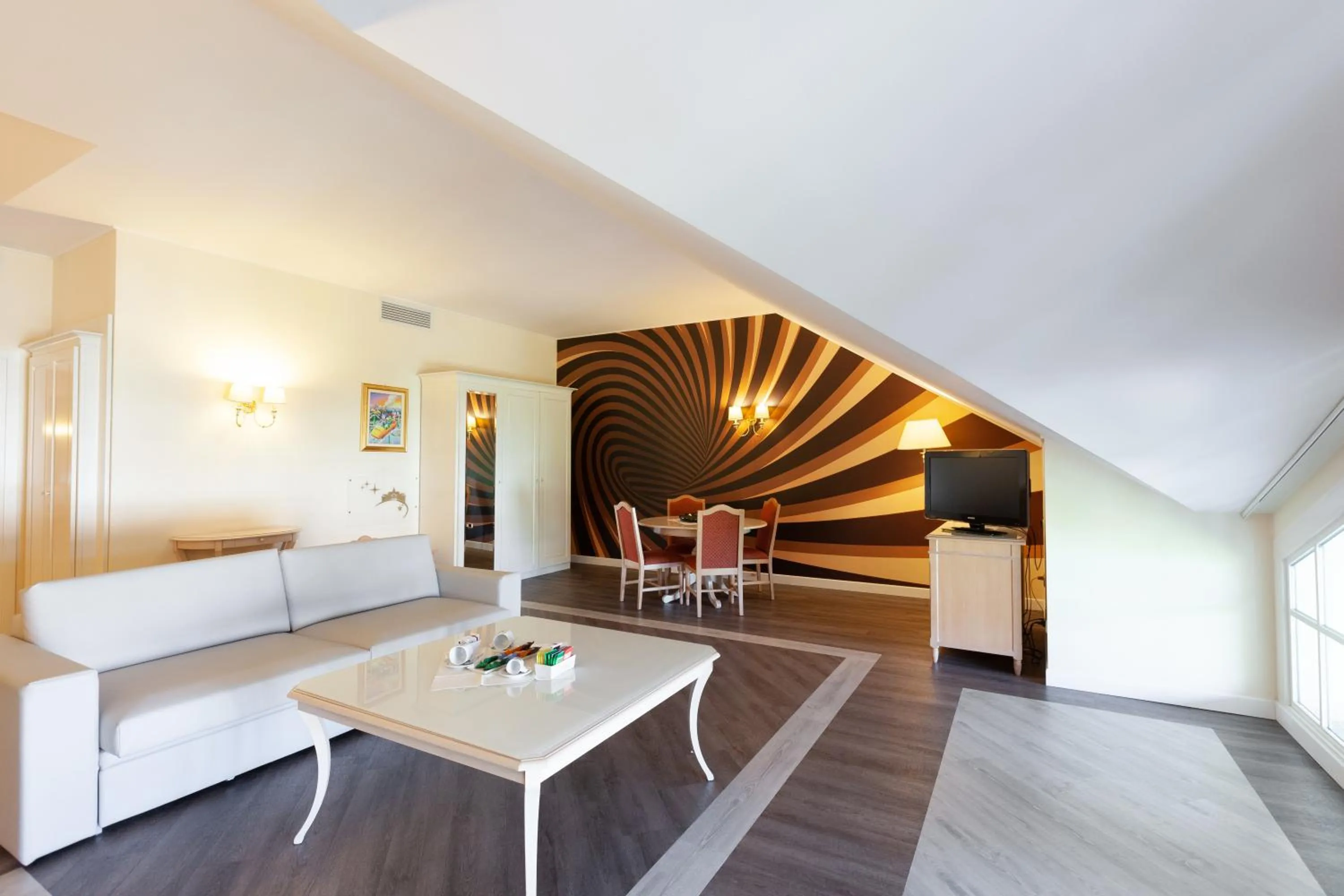 Living room, Bed in Gardaland Hotel