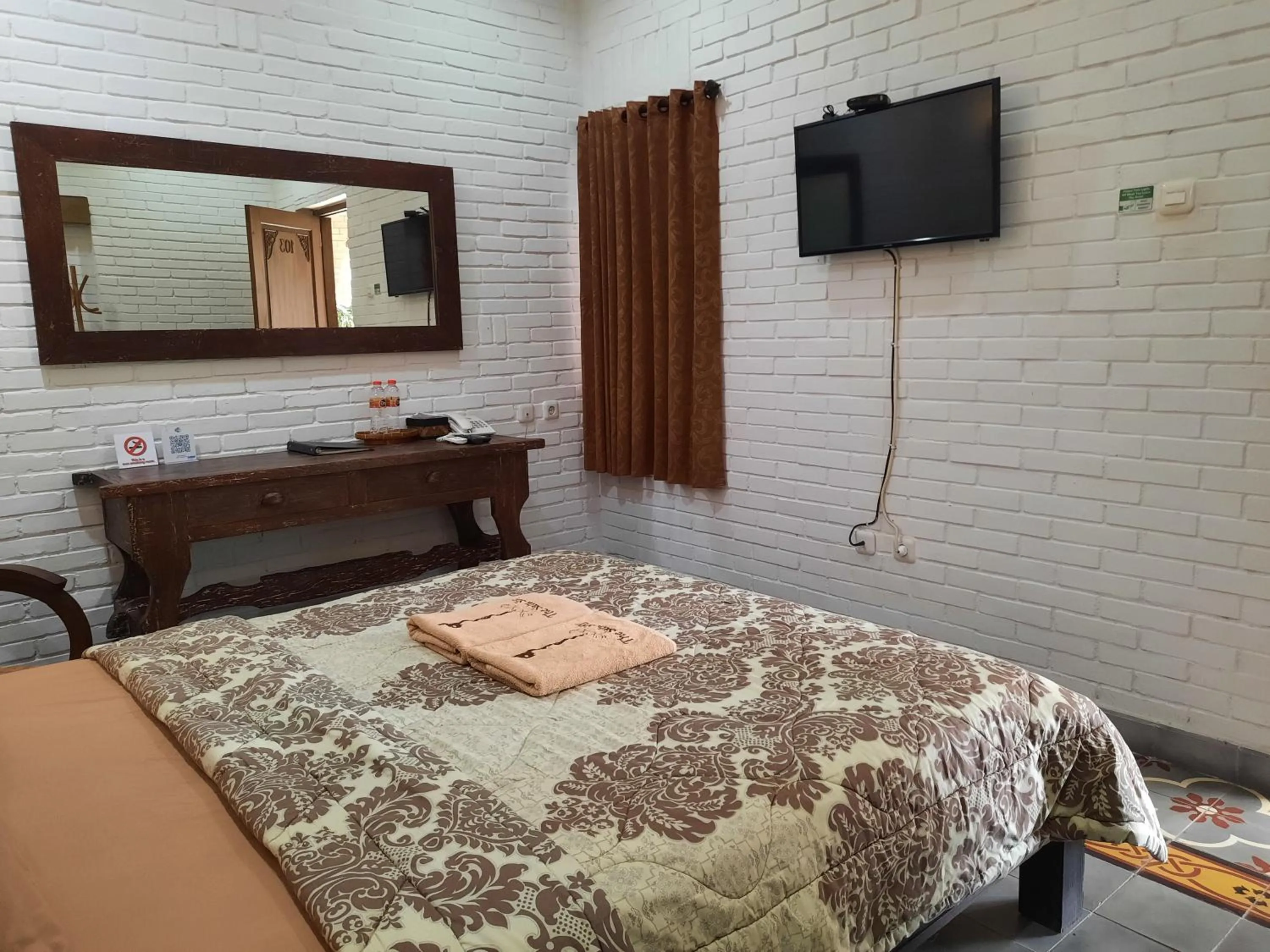 Bed in The Satu Stay Kayen