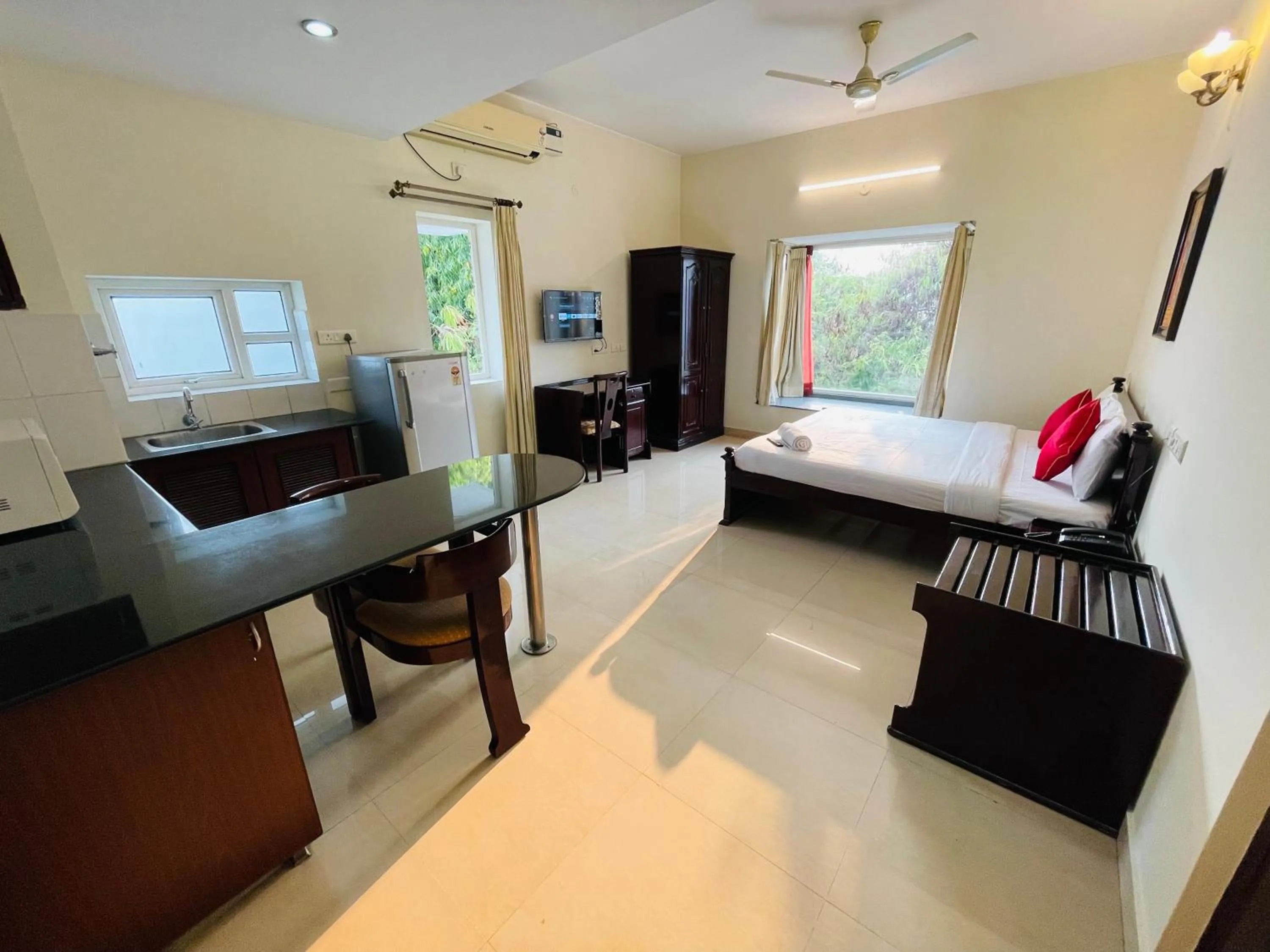 Kitchen or kitchenette, Bed in Sanctum Suites Indiranagar Bangalore
