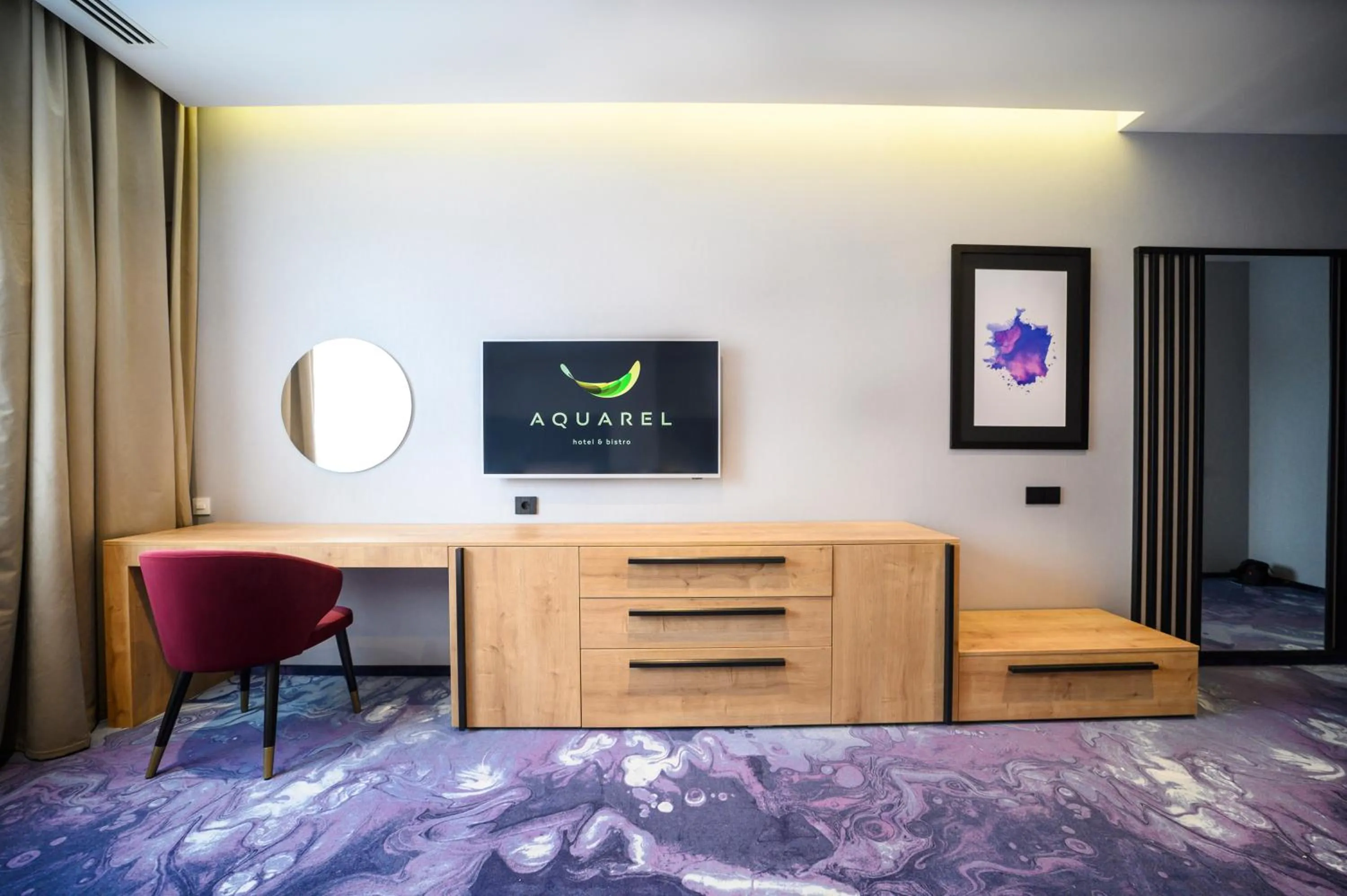 Communal lounge/ TV room in Hotel Boutique Aquarel