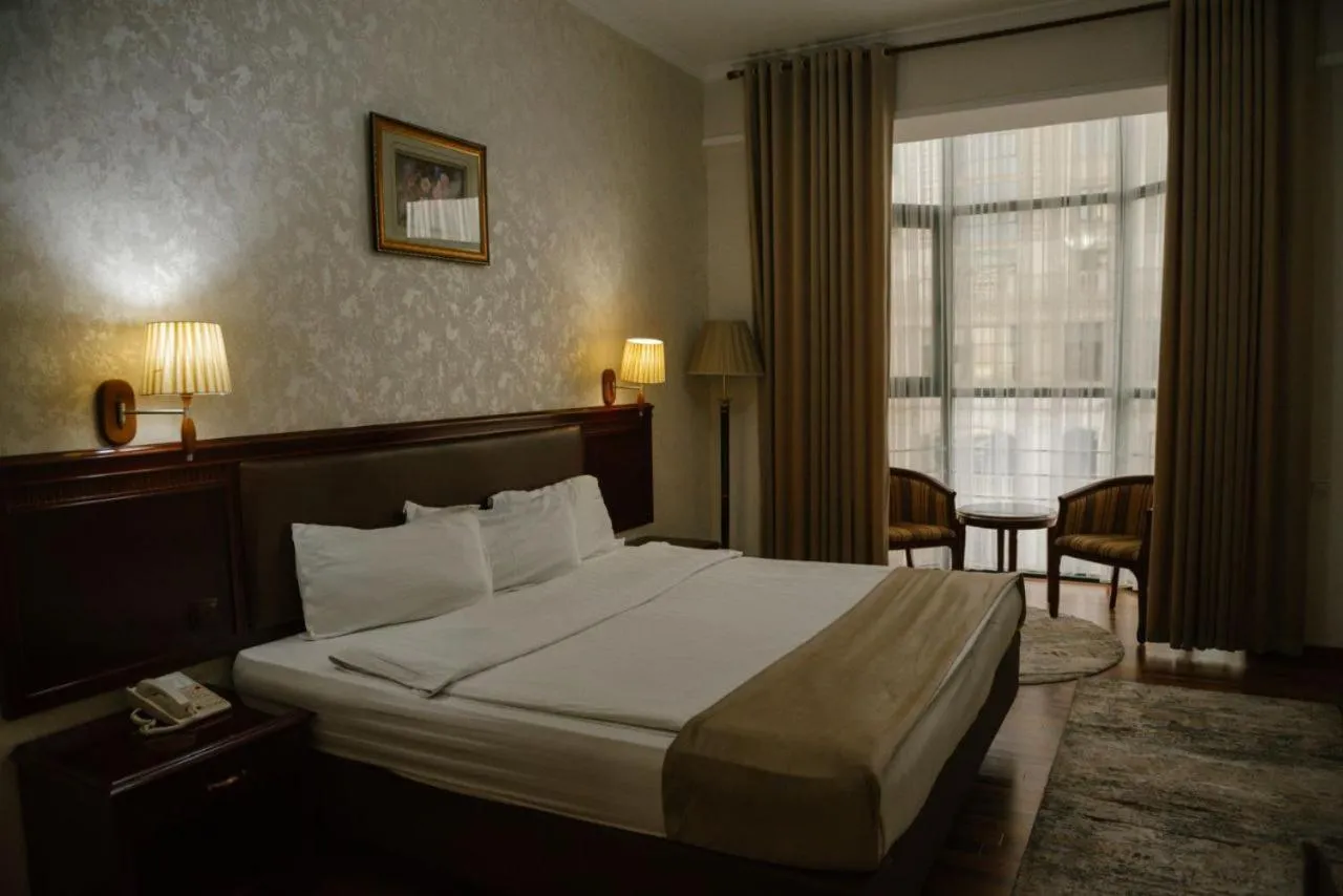 Bed in Asia Grand Hotel