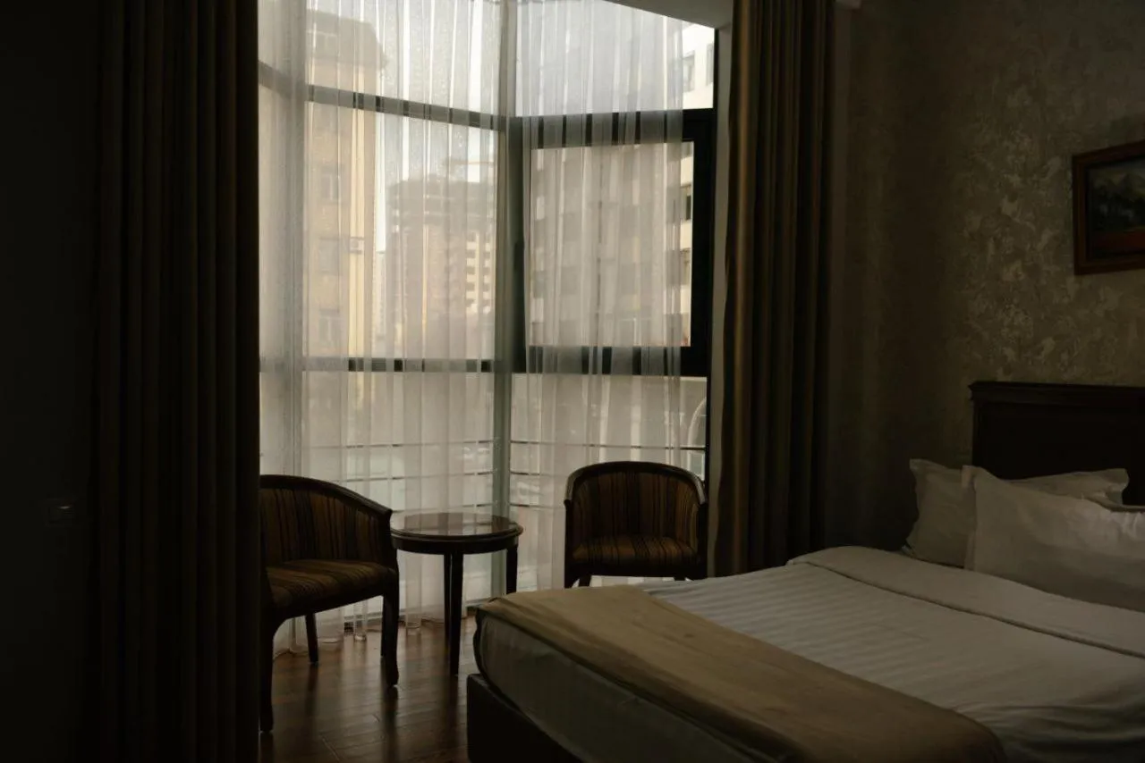 Bed in Asia Grand Hotel