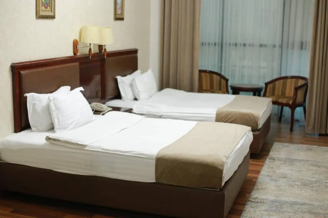 Bed in Asia Grand Hotel