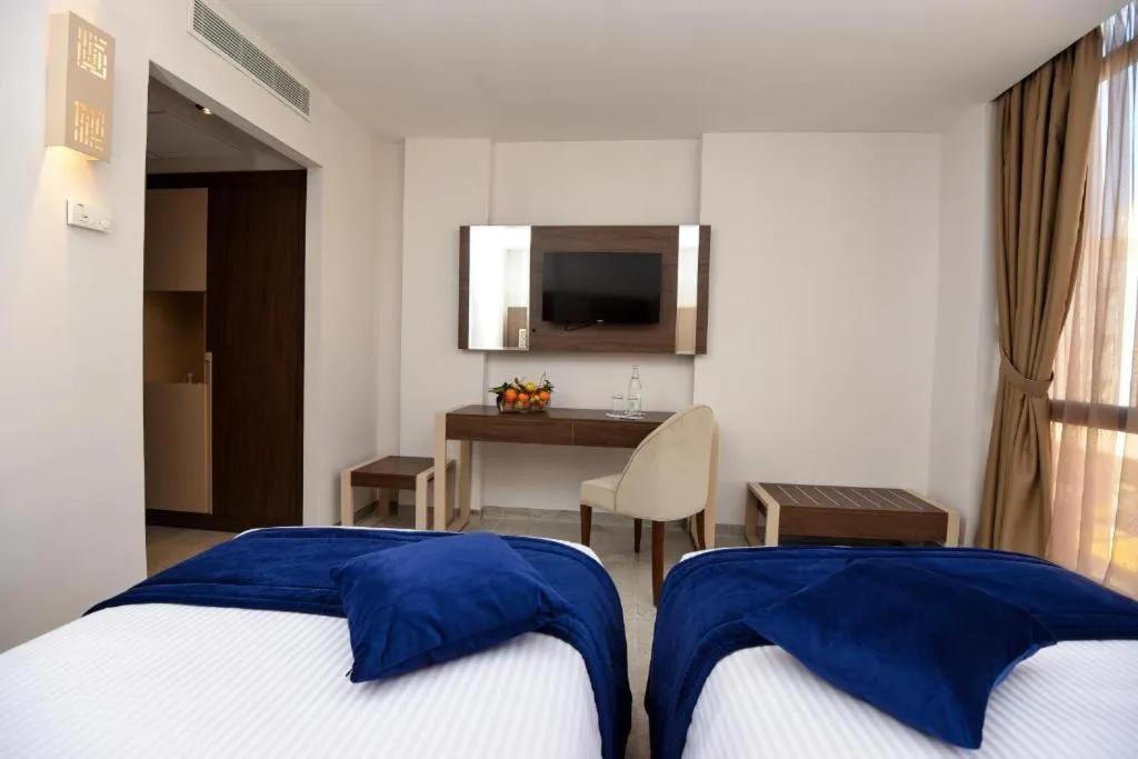 Communal lounge/ TV room, Bed in Hôtel Lescure Business and SPA