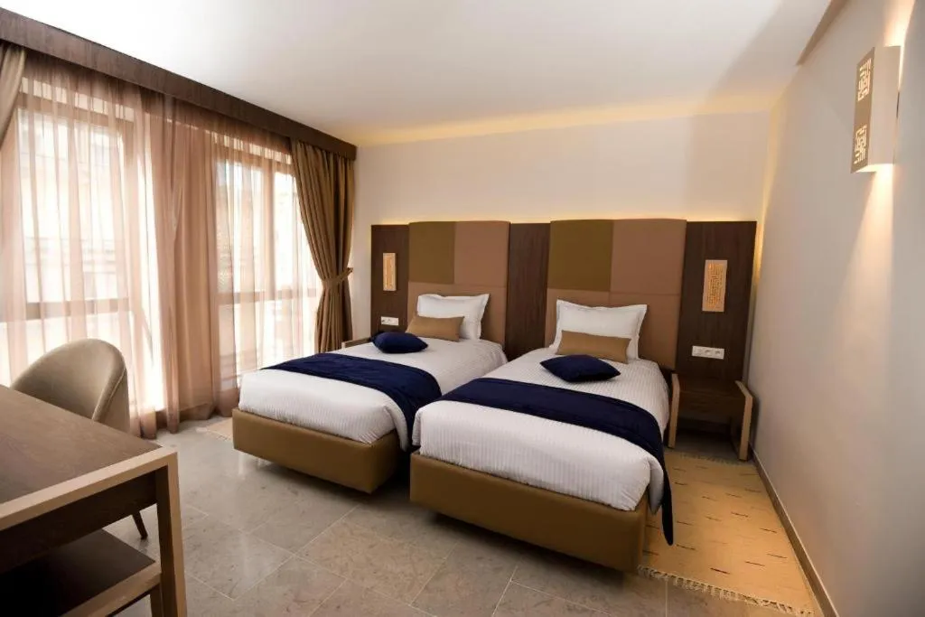 Bed in Hôtel Lescure Business and SPA