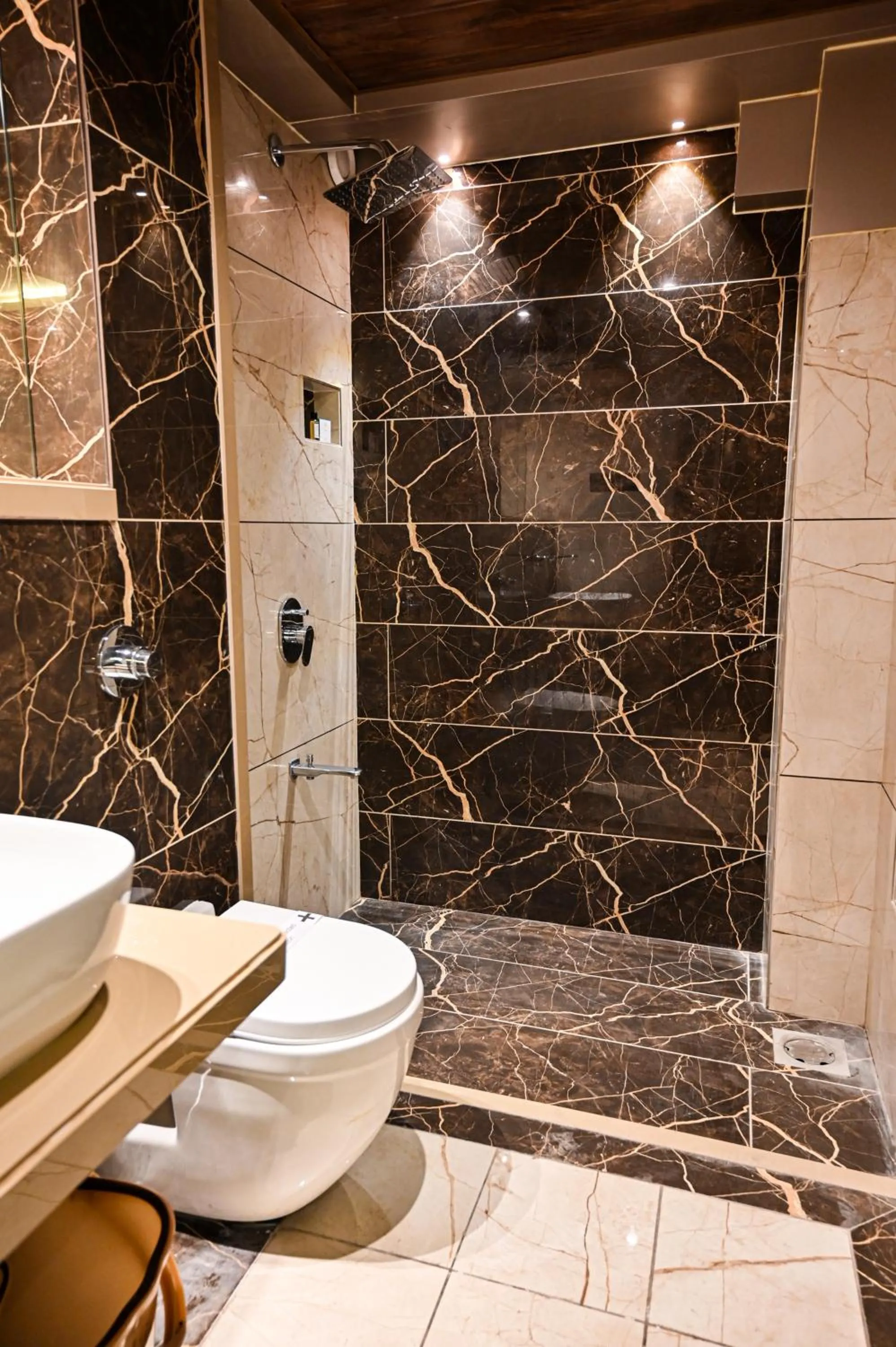 Bathroom in Suvidha Suites