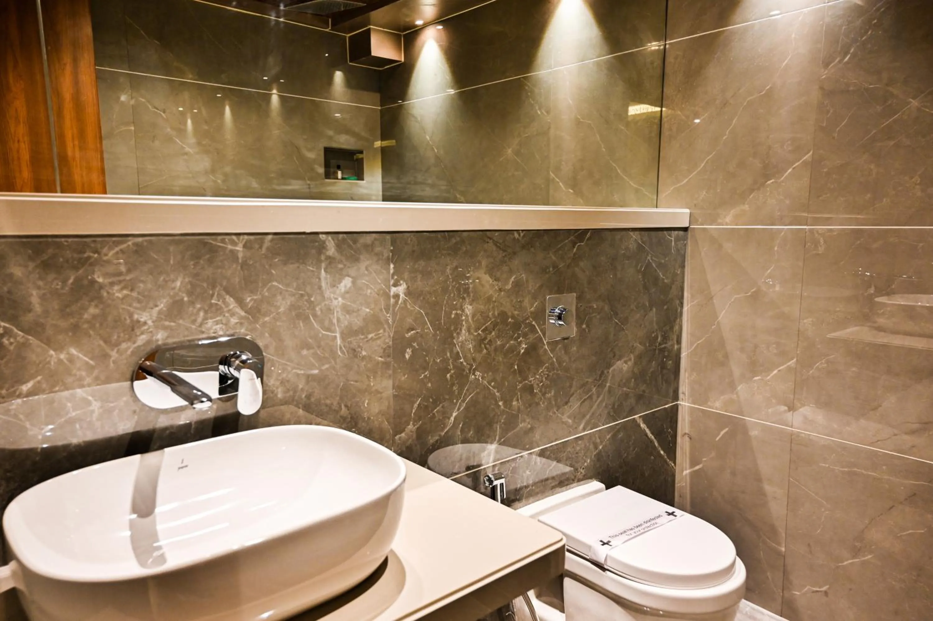 Bathroom in Suvidha Suites