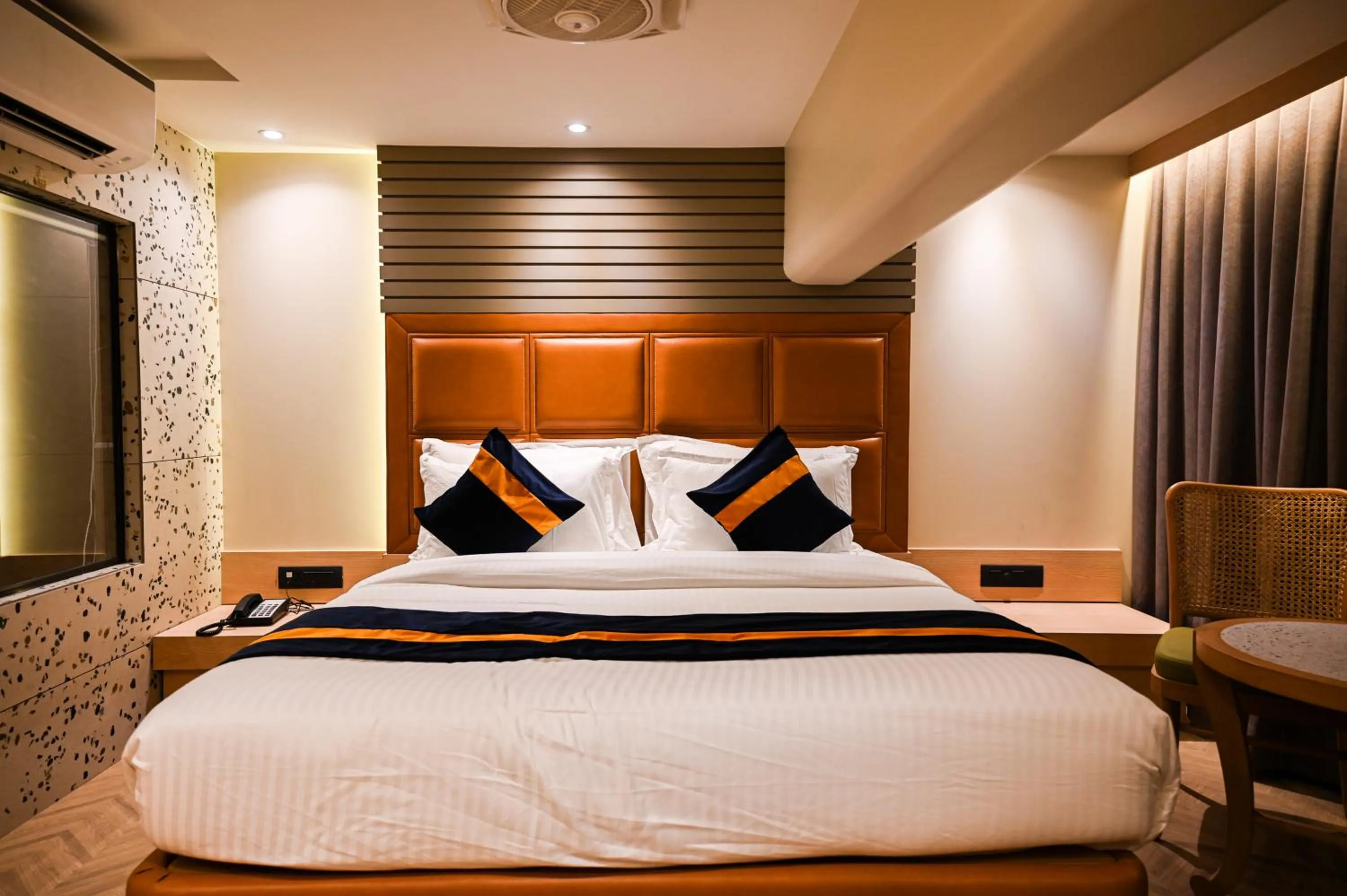 Bed in Suvidha Suites