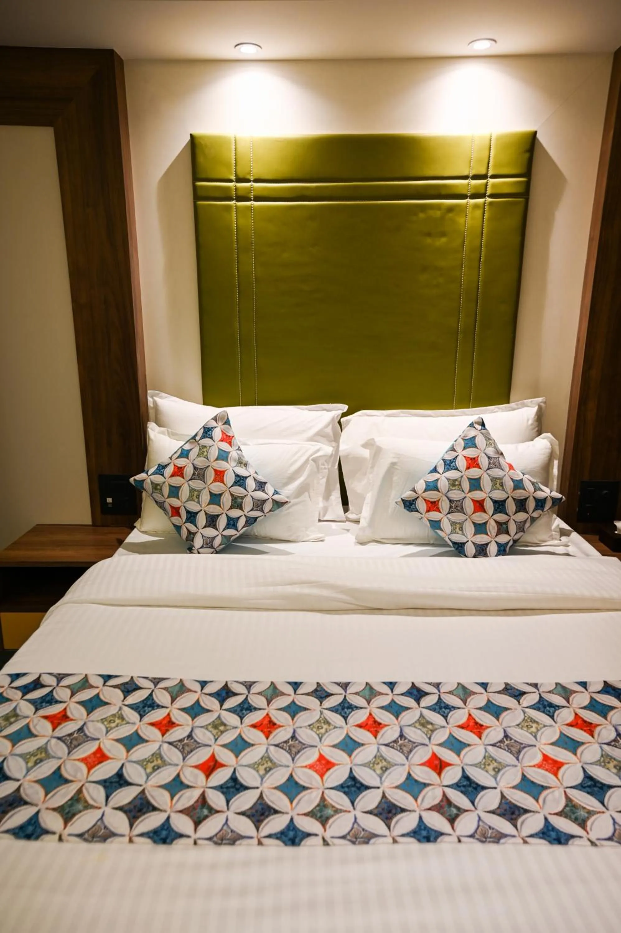 Bed in Suvidha Suites