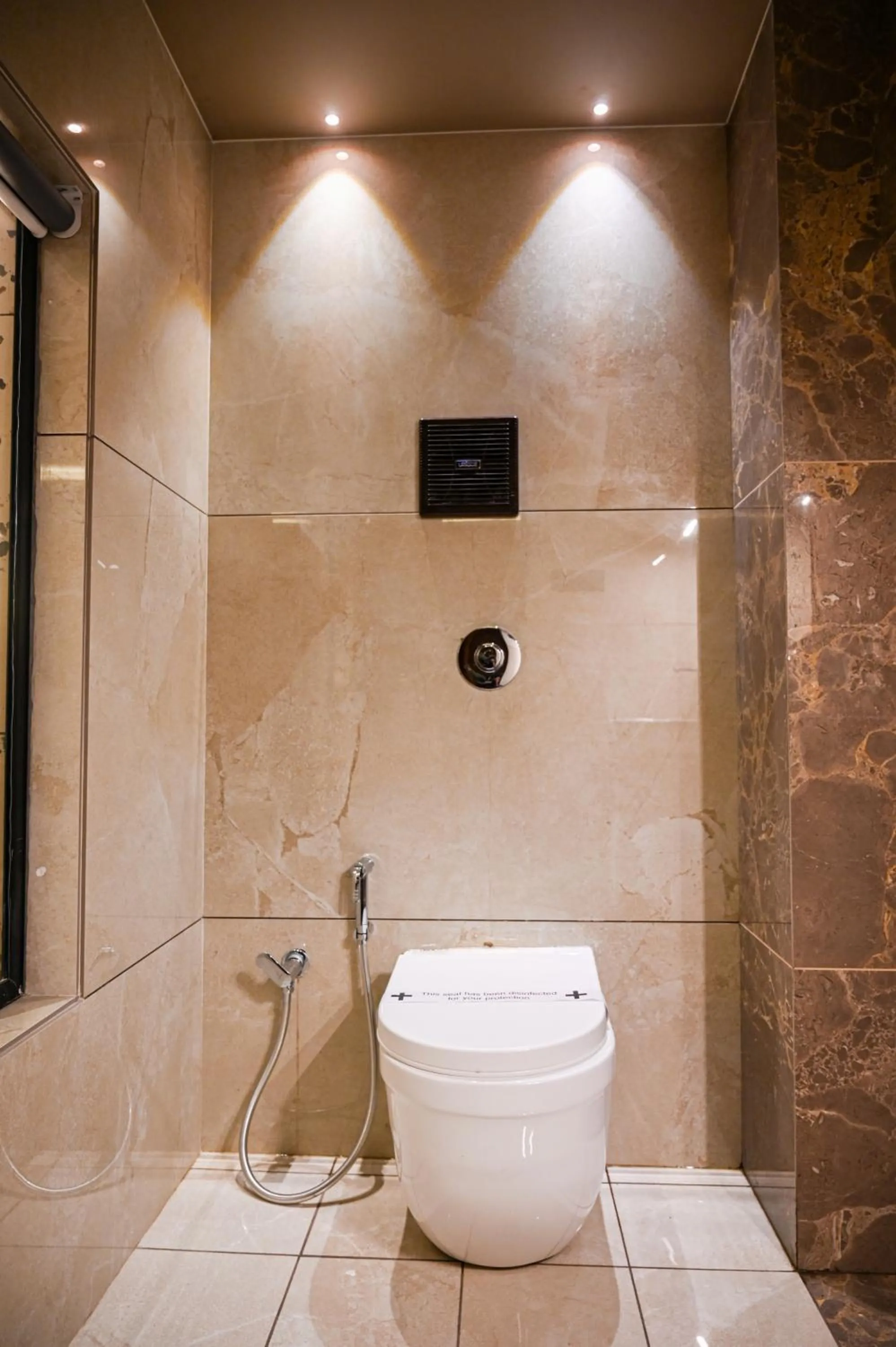 Bathroom in Suvidha Suites