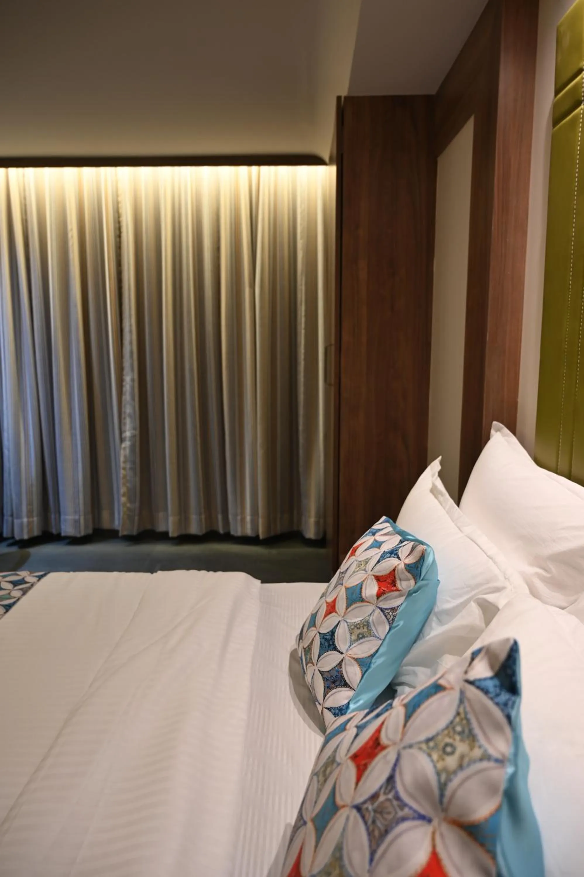 Bed in Suvidha Suites