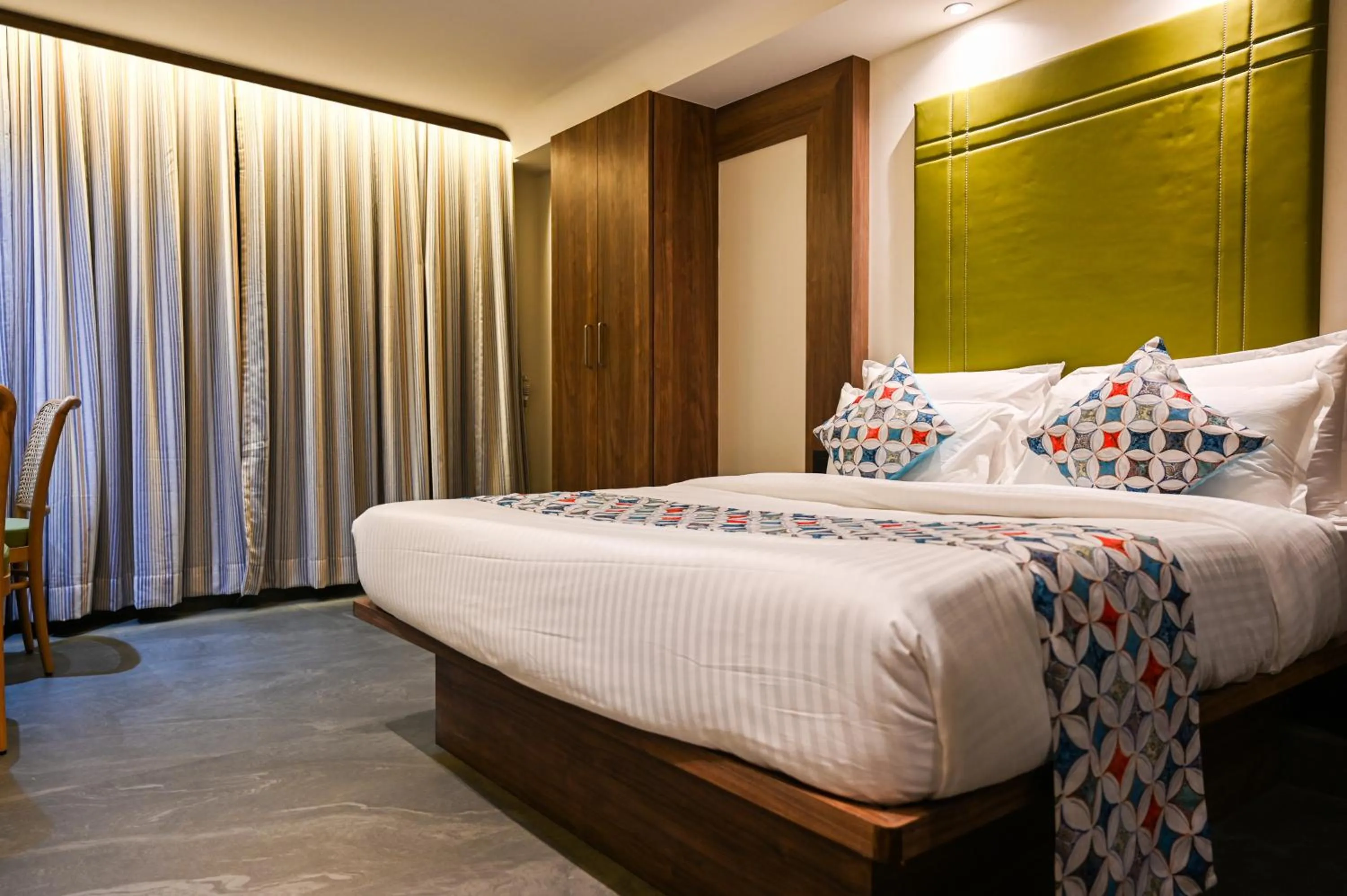 Photo of the whole room, Bed in Suvidha Suites