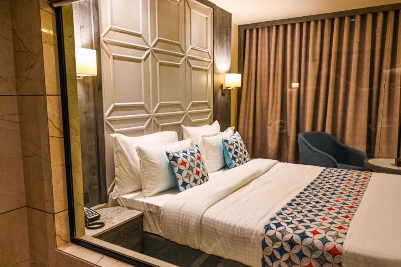 Bed in Suvidha Suites
