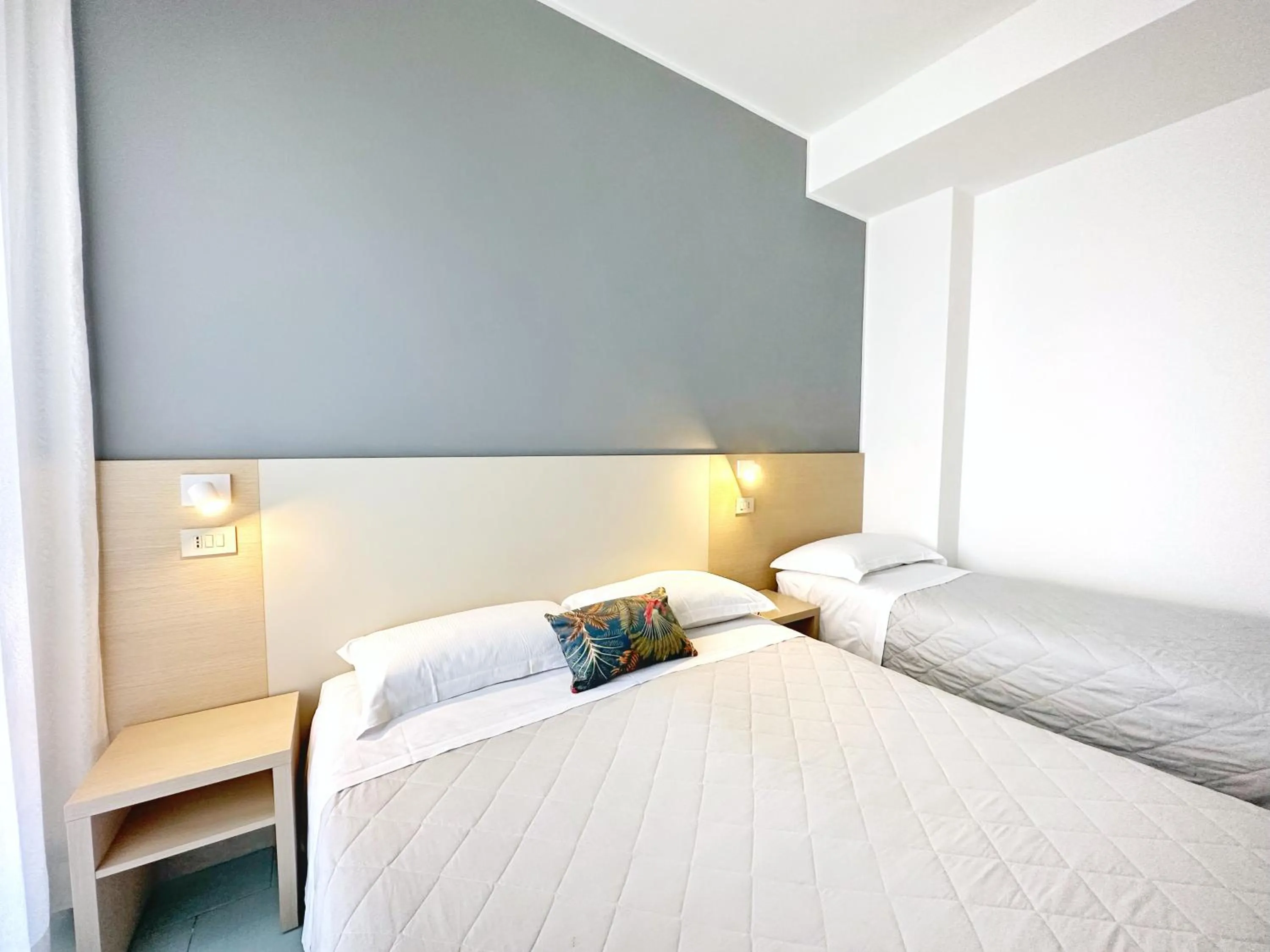 Bed in Aura Living Hotel