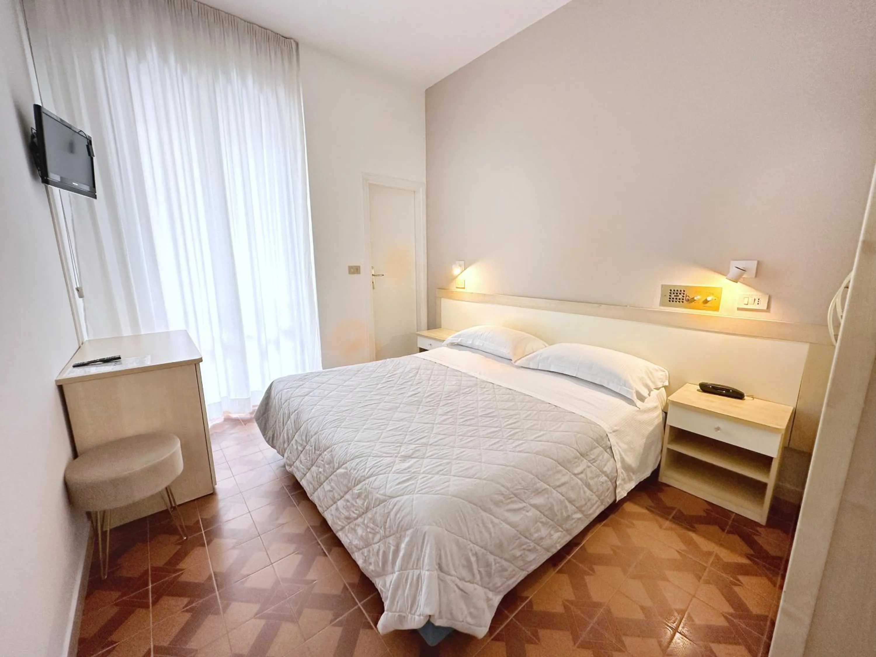 Bed in Aura Living Hotel