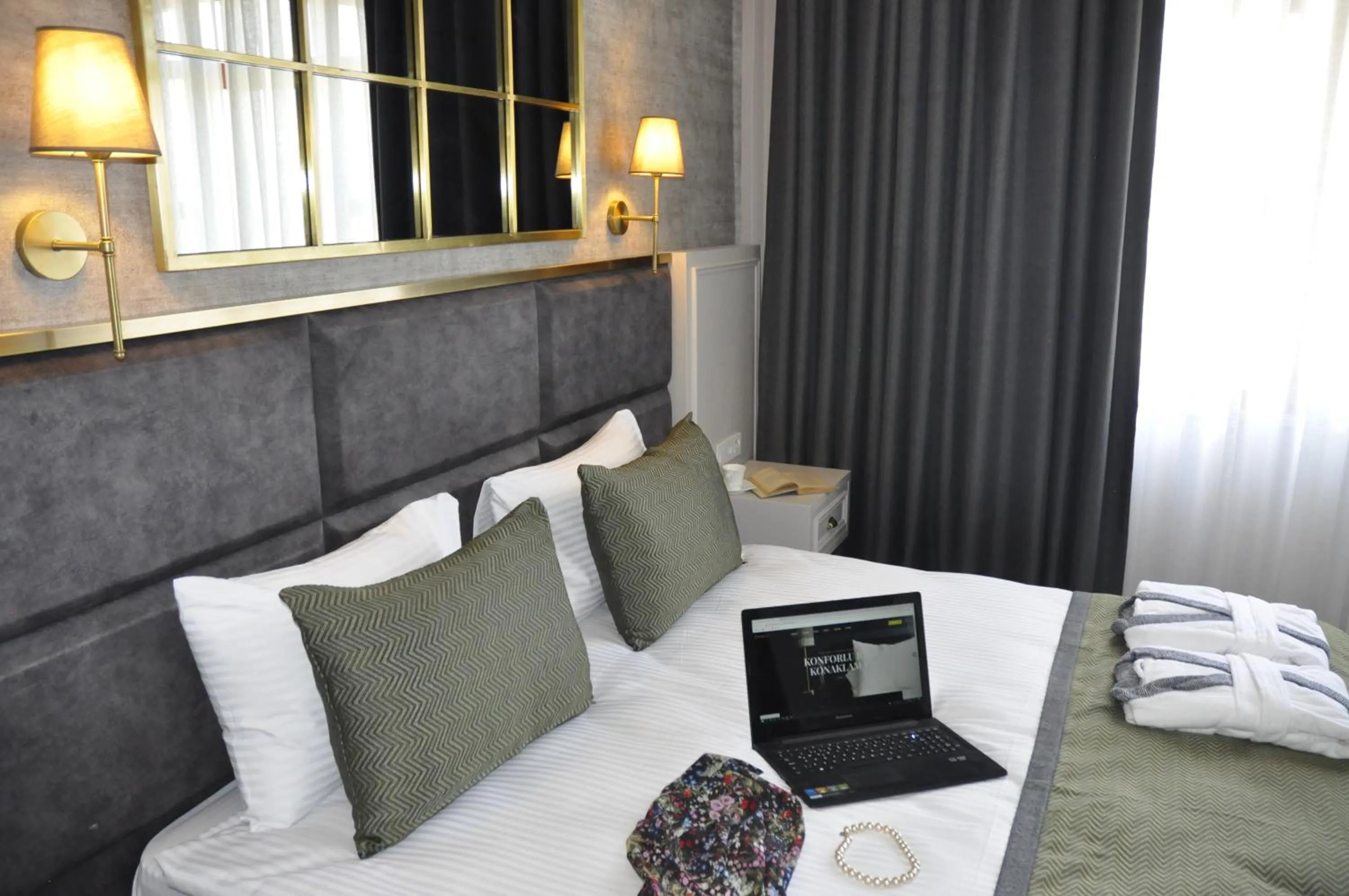 Bed in CONNECT THERMAL HOTEL