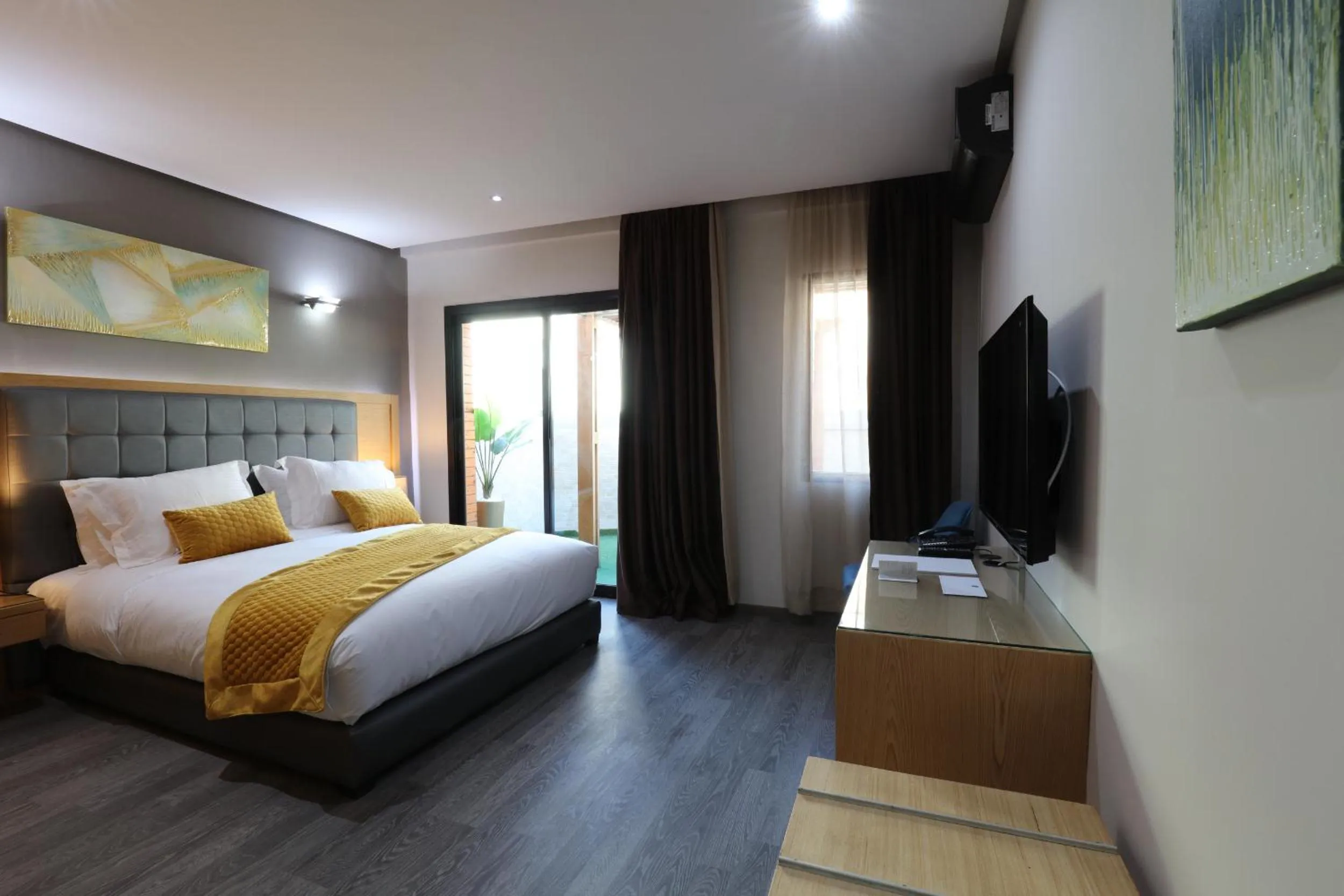 Communal lounge/ TV room, Bed in Silver Suites Hotel & Spa Casablanca