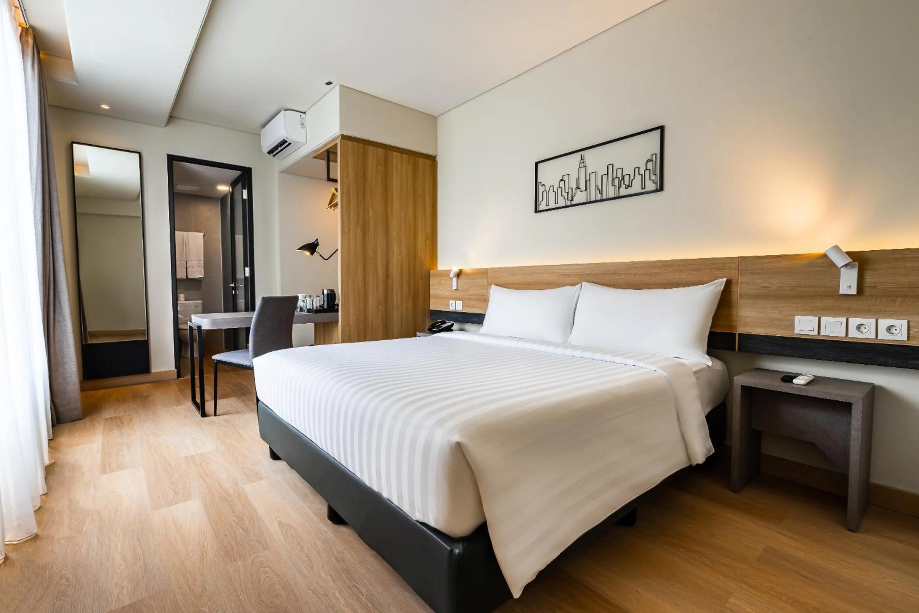 Photo of the whole room, Bed in Quest Prime Pemuda - Semarang