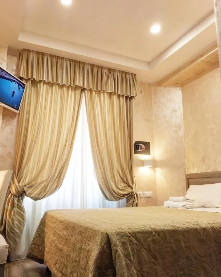 Bed in Hotel Orchidea