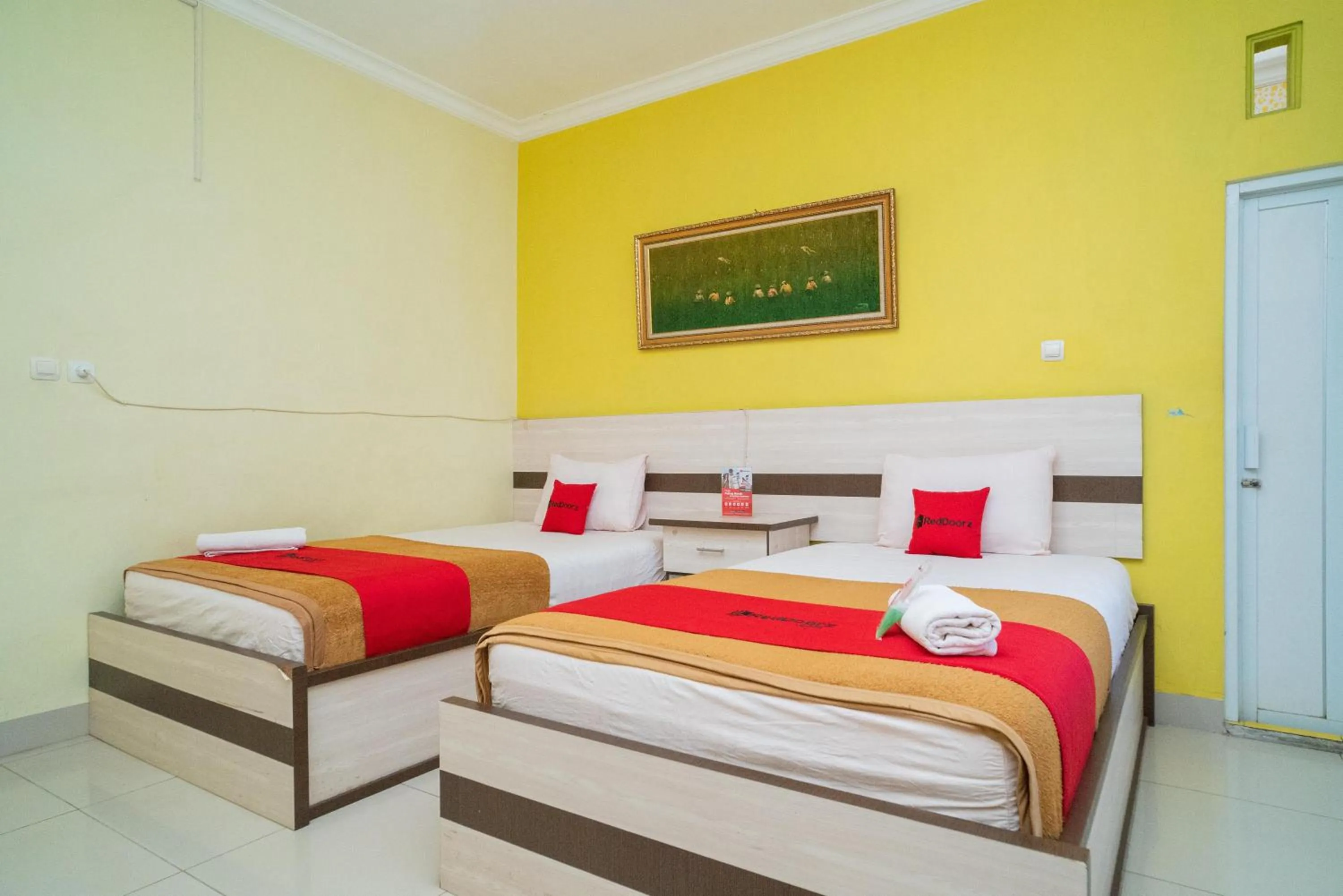 Bed in RedDoorz Syariah Near Lapangan Dwiwarna Barabai