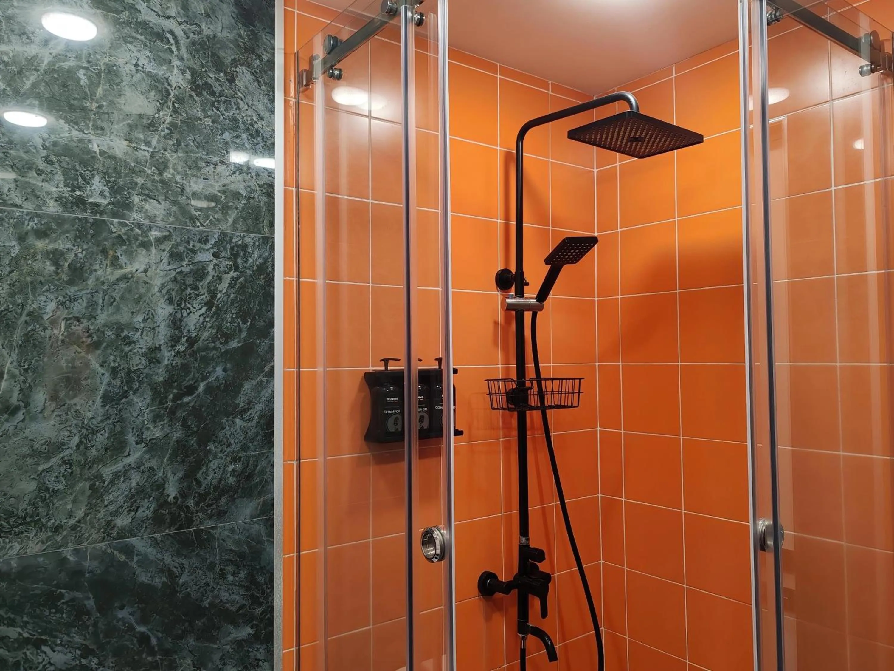 Shower in Rooms Apart Hotel by RED