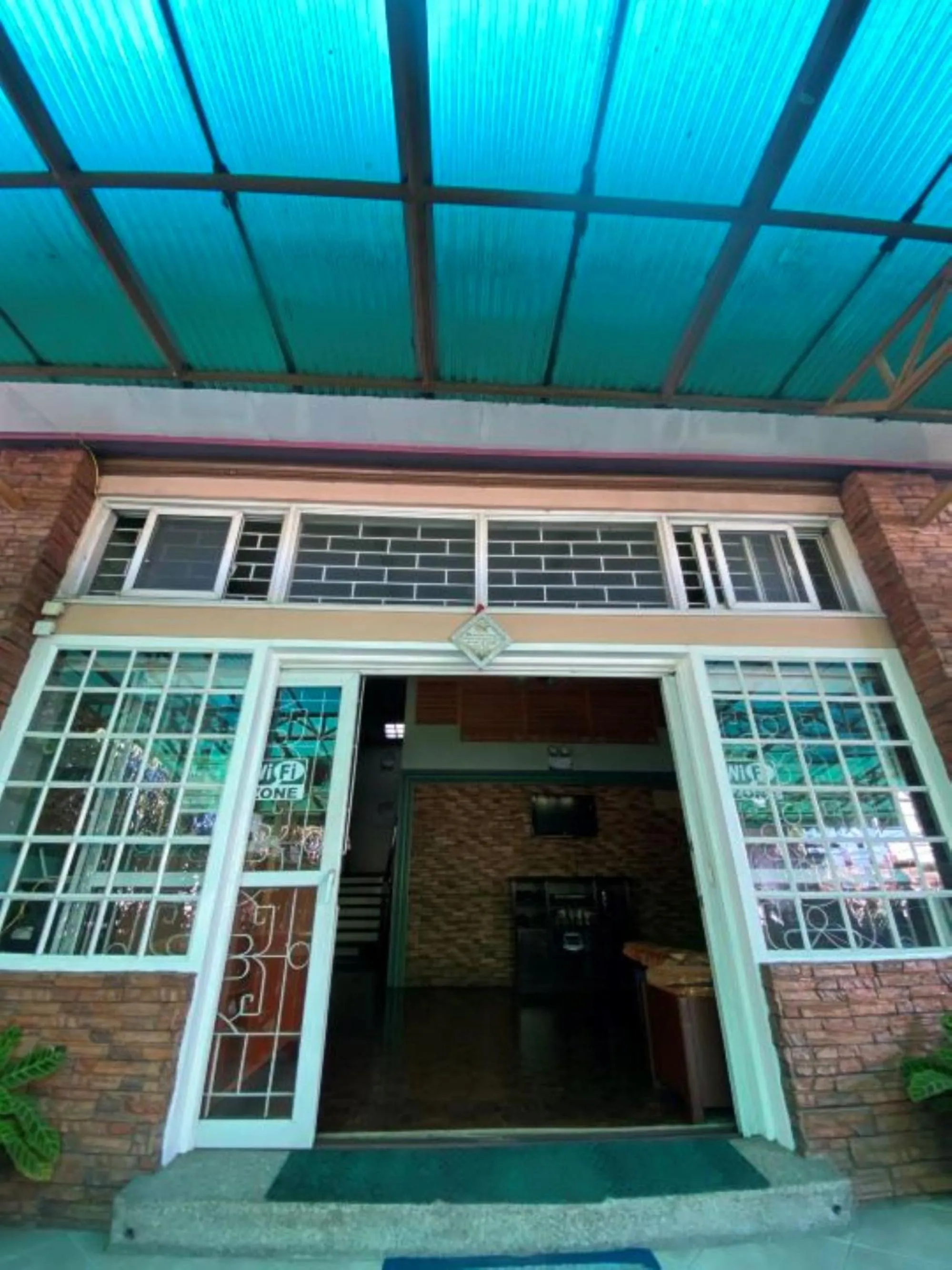 Facade/entrance in RedDoorz Hostel at MRC Residences Baguio