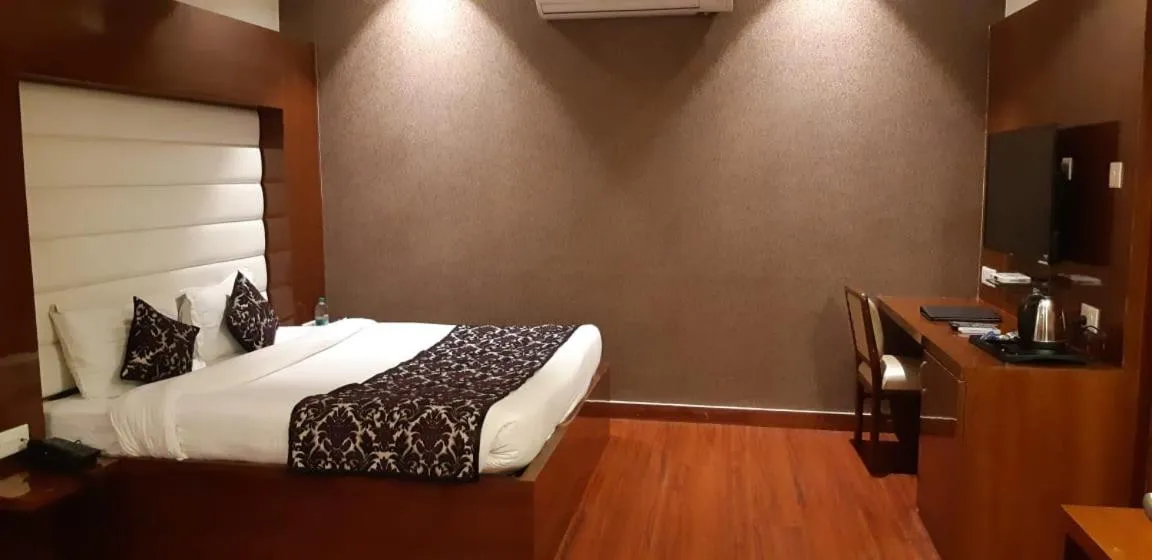 Bed in Grand Geet Hotels