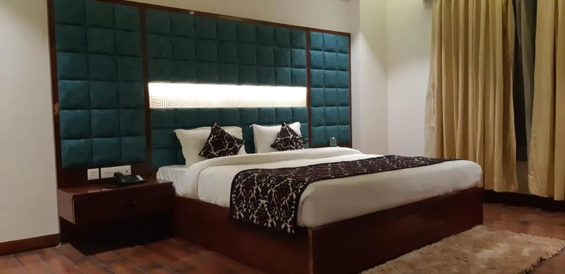 Bed in Grand Geet Hotels