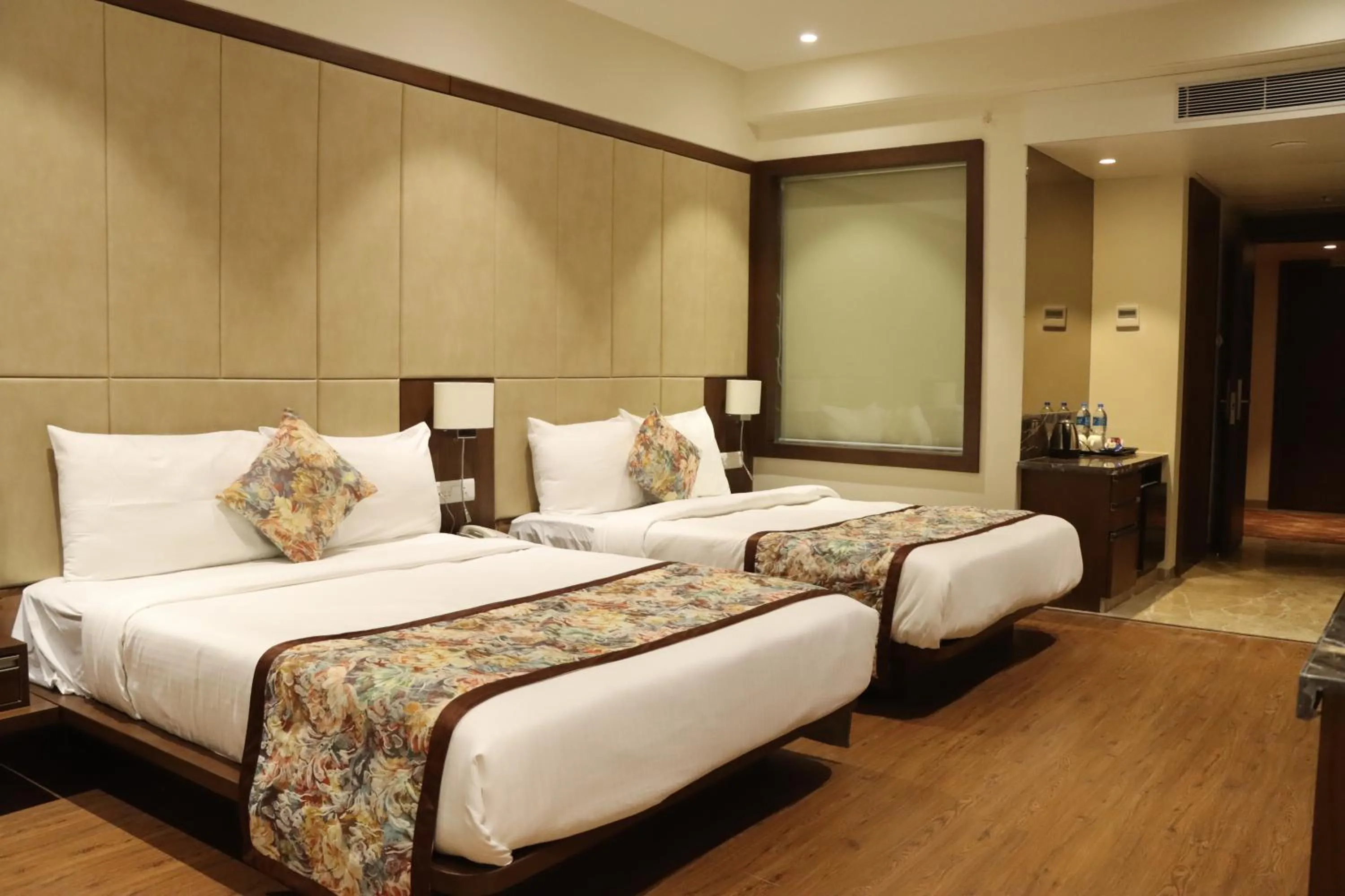 Bed in Pride Hotel Bhopal