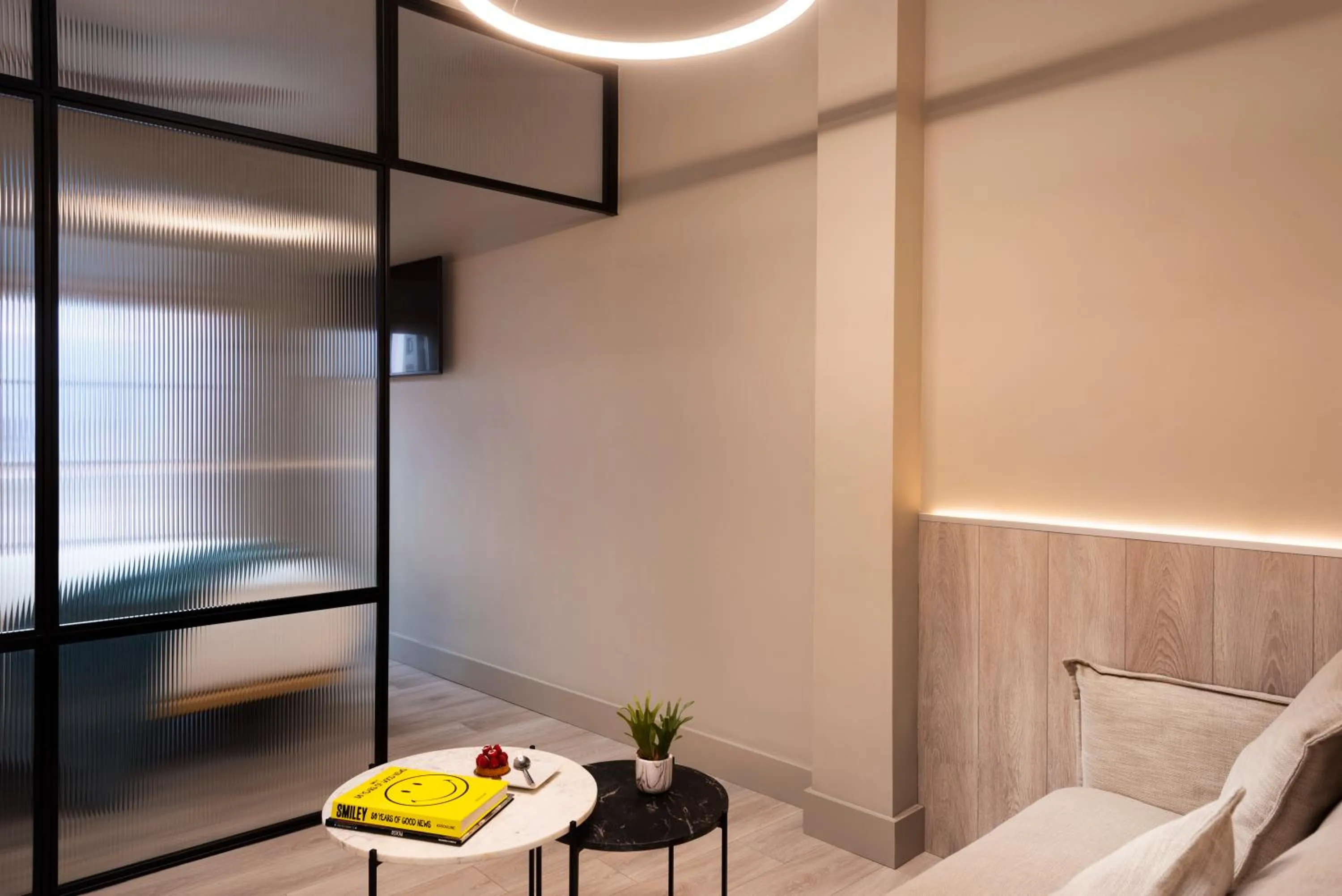 Seating area, Bed in Coeo Peña Design Apartments